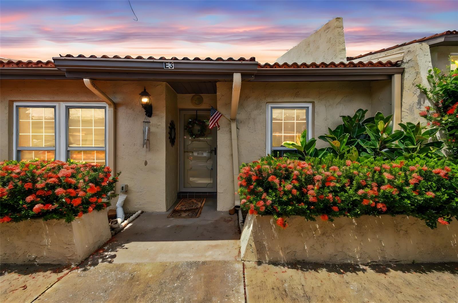 Discover your Florida retreat in this beautifully updated villa located in the well-maintained Villa Nueva community in Largo—high and dry with no flood insurance required! Whether you're seeking a seasonal getaway or a full-time residence, this home offers a rare blend of modern finishes and easy living. Step inside to find durable porcelain tile flooring throughout and an open-concept layout designed for comfort and functionality. The gourmet kitchen features abundant granite countertops, a sleek tile backsplash, solid cherry wood cabinetry, and a full suite of stainless steel appliances including a KitchenAid refrigerator and range with stylish vent hood, plus a Haier dishwasher. A large breakfast bar with seating for four opens to the spacious living area—ideal for everyday living or entertaining guests. The front bedroom has been thoughtfully designed with versatility in mind, complete with a queen-size memory foam Murphy bed, a drop-down work desk, and California Closet organizers for maximum storage. The adjacent guest bathroom features a tub/shower combo with striking floor-to-ceiling tilework. Tucked away for privacy, the primary suite also includes California Closet organizers, an updated ensuite bathroom which also features floor-to-ceiling tile, with a walk-in tiled shower, and a convenient all-in-one washer/dryer for added ease. At the back of the villa, a tiled and enclosed patio extends your living space and overlooks a peaceful greenbelt, offering a quiet, scenic setting to enjoy Florida’s weather year-round. The patio is even wired for a wall-mounted TV, making it an ideal spot for unwinding in any season.
Additional updates include a new HVAC system and ductwork installed in 2024, hurricane-rated PGT windows throughout (2015), and added attic insulation in 2019. The home also includes a covered carport directly in front and an additional storage unit.
Villa Nueva offers an easygoing lifestyle with a low monthly HOA that covers cable, internet, water, sewer, trash, exterior building maintenance (including the roof), lawn care, pest control, and access to the community pool and clubhouse.
Located just 10 to 20 minutes from Clearwater Beach, St. Pete–Clearwater Airport, and Tampa, this villa puts you close to the Gulf Coast’s best attractions, restaurants, and entertainment.
Don’t miss this move-in ready gem—schedule your private tour today and see everything this beautifully updated home has to offer!