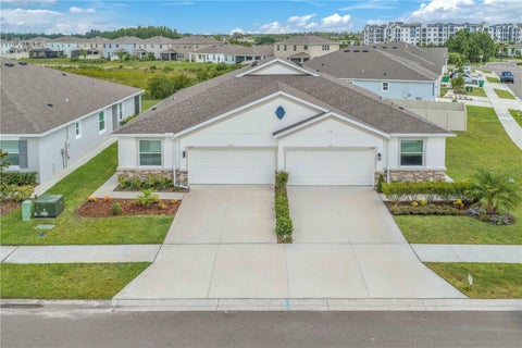 Photo of 32313 Lexington Street, Wesley Chapel, FL 33543 (MLS # TB8518078)