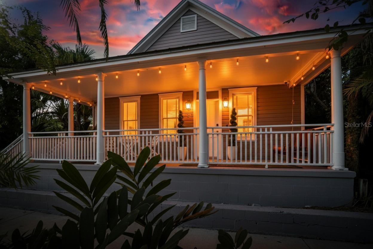 Experience a piece of Tampa history paired with modern elegance at 1722 E 5th Ave. Built in 1908 by Emilio Pons, one of Ybor City’s original cigar magnates and founder of the Ponce De Leon brand, this home offers authentic historic character and today’s comforts in equal measure. Meticulously upkept and thoughtfully updated, it retains its original wood floors while showcasing curved walls, contemporary lighting, and a spacious layout that blends modern living with timeless charm. The galley kitchen features graceful archways, thick moldings, granite countertops, stainless steel appliances, and a gas range, opening to a bright great room with French doors leading to a private, fully decked side yard and cozy fireplace. Upstairs, the master suite offers an ensuite bath, a loft perfect for an office or studio, and a wraparound balcony overlooking the property. Fully fenced with multiple decks, balconies, and a storage shed, this home sits just steps from 7th Avenue and the Ybor trolley. The hot tub may convey if desired. All TVs left behind are also included.
