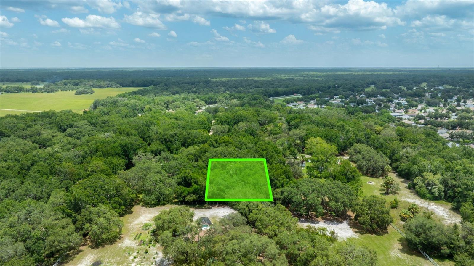 Unlock 1.25 acres of peaceful Florida countryside in Dunnellon—no HOA, no hassle. Zoned A1, this build-ready lot welcomes single-family or mobile homes (min. 1,000 sq ft) and even short-term rentals with proper permits. Power runs at the road, and you can add well/septic per county guidelines. Nestled on SW 141st Pl, a maintained dirt road, this wooded retreat sits just 10 miles from Marion Oaks & Hernando and 66 miles from Orlando. Enjoy space to breathe, nearby schools and outdoor escapes, and low annual taxes of only $247.24. Whether you’re building a home, setting up a rental, or holding for the future—this is your blank canvas.