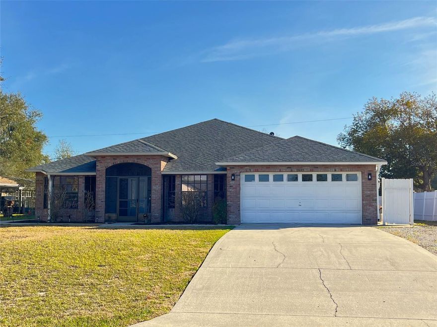 Welcome to your dream home in beautiful Deltona! This stunning 4 bedroom 2 bathroom residence offers over 2,100 sq. ft of thoughtfully designed living space. Step inside to a welcoming formal living room and dining room , perfect for elegant gatherings. The open concept kitchen and family room flow seamlessly, offering plenty of space for relaxation or entertaining. A spacious primary suite with large walk-in closet and soaker tub to relax in. Three guest rooms are spacious and each have large closet space. The guest bath room is updated with duel shower heads. Enjoy your days in the screen porch. There is an bonus space that is under A/C with a golf cart size garage door. Outside the yard is generous with room to store additional vehicles.  This is a must see home! Make your appointment today!