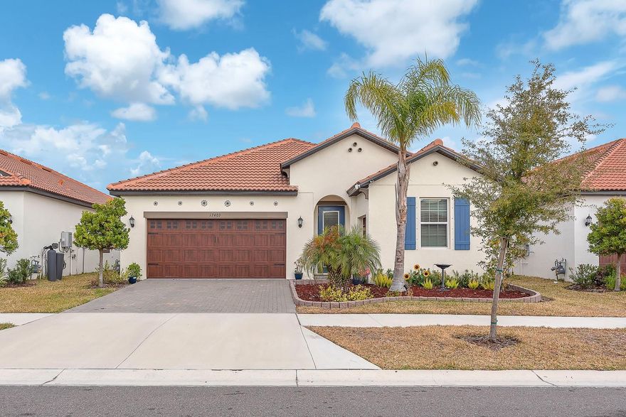 Welcome to your dream home in the vibrant 55+ community of Medley at Southshore Bay, where comfort, style, and an active lifestyle come together. This beautifully designed 3-bedroom, 2.5-bath residence with a versatile bonus room behind glass doors offers an inviting open-concept layout perfect for both everyday living and entertaining. The combined living and dining areas flow seamlessly into a well-appointed kitchen featuring stainless steel appliances, a spacious island with room for seating, and abundant counter space for hosting family and friends.
Designed with a desirable split-bedroom floor plan, the private primary suite is tucked away at the back of the home and features an en-suite bath with dual sink vanity, glass-enclosed shower with rain shower head, private water closet, and a spacious walk-in closet. Bedrooms two and three share access to the second full bathroom, while a convenient powder room provides added comfort for guests. The bonus room offers endless possibilities—ideal for a home office, hobby space, or guest retreat. An upgraded glass front door adds a touch of elegance and welcomes you inside.
Step outside to a screened and pavered lanai overlooking a peaceful backyard setting—perfect for relaxing mornings or evening gatherings. A 2-car garage provides ample storage and convenience. Enjoy resort-style living with Medley’s exceptional amenities, including a crystal-clear community pool, fitness center, pickleball courts, clubhouse with restaurant, and a full calendar of social activities. This home offers more than just beautiful features—it offers the lifestyle you’ve been waiting for.