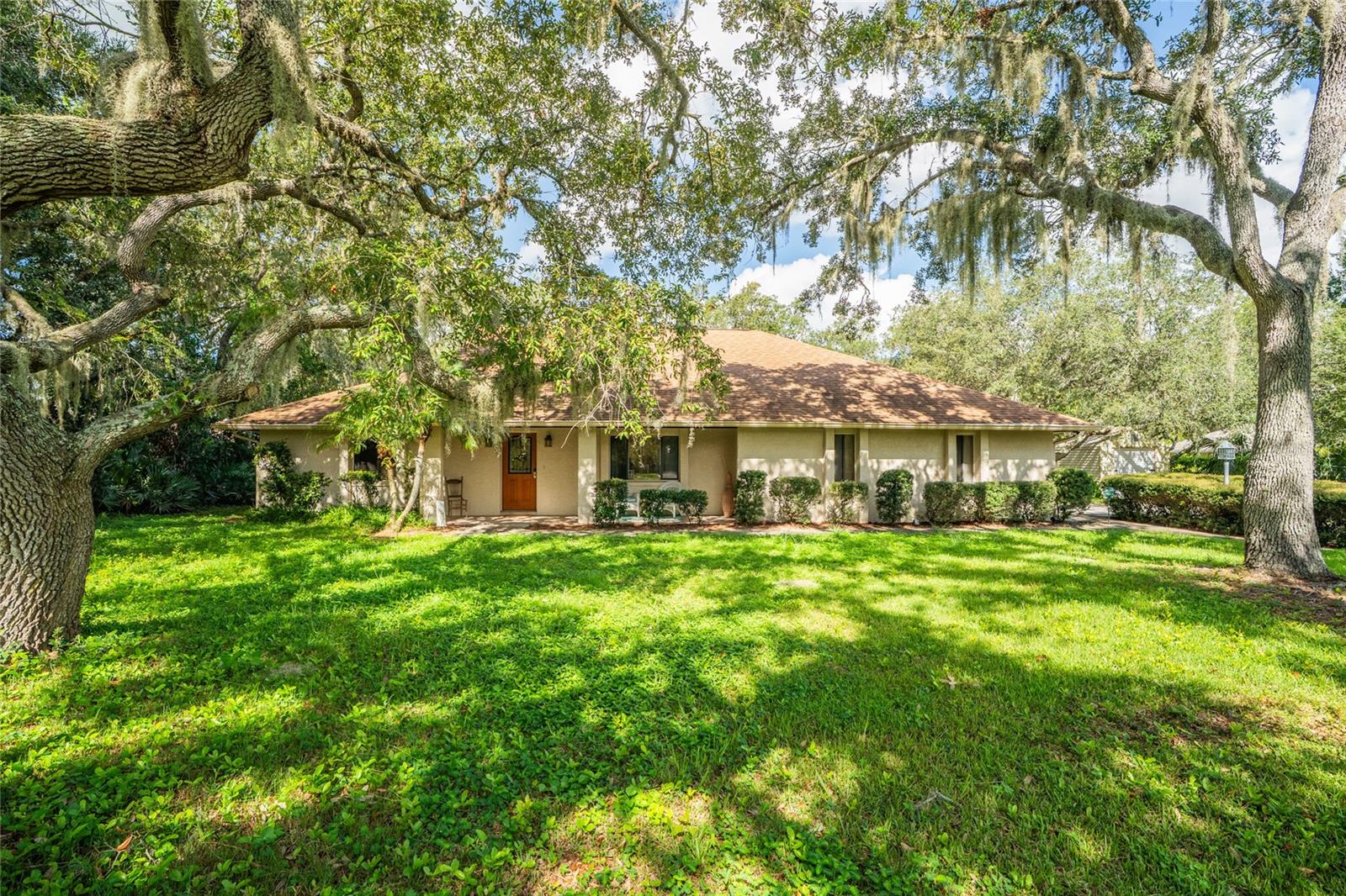 Welcome to your private oasis in Spruce Creek Woods! This charming 4-bedroom, 2-bathroom pool home sits on a spacious 1-acre lot with no HOA, offering the perfect combination of comfort, freedom, and functionality. Thoughtfully maintained, this single-story residence features a split bedroom floor plan, a newer roof for added peace of mind, and a termite bond with Massey already in place. Inside, you’ll find a large Florida room, a wood-burning fireplace, and an inside laundry room. The kitchen and living areas flow seamlessly, creating a warm and inviting atmosphere. Step outside to a backyard retreat complete with a sparkling pool, gazebo area, and shed, all surrounded by mature trees for enhanced privacy. Enjoy the convenience of city water paired with a septic system to help keep utility costs low, plus a two-car garage for ample storage and parking. Perfect for entertaining or simply enjoying the serene setting, this property offers room to grow and a peaceful environment—all just minutes from shopping, dining, and top-rated schools. Don’t miss this rare opportunity to own in one of Port Orange’s most desirable acreage communities!