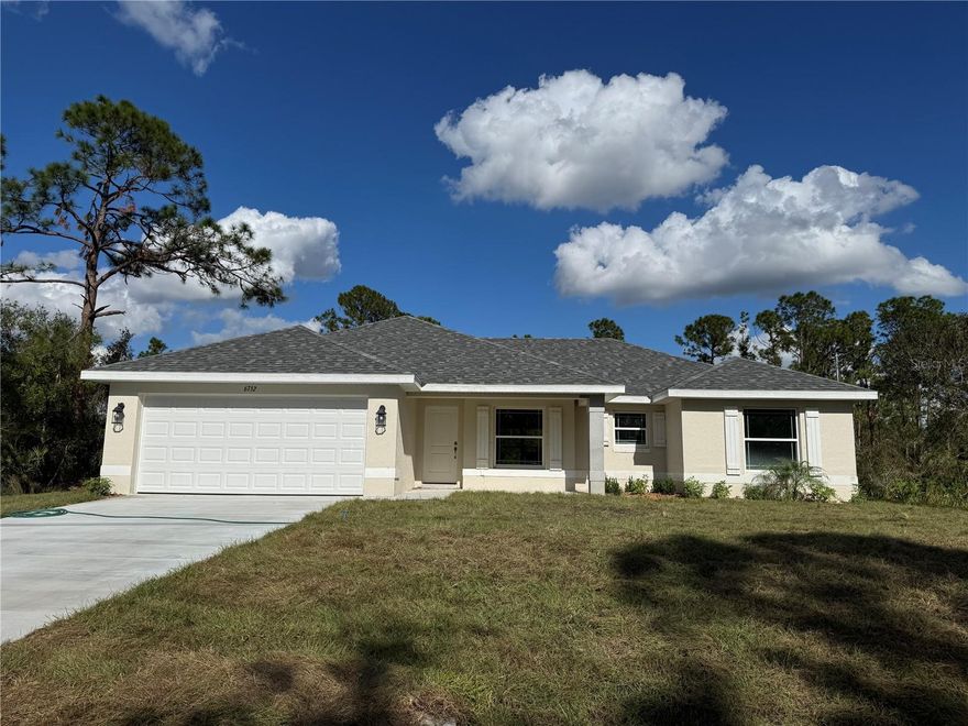 Welcome to your new home in beautiful North Port, Florida! This charming 3-bedroom, 2-bathroom residence with a 2-car garage offers a perfect blend of comfort and style, situated in a vibrant community known for its wonderful amenities and attractions. Designed for privacy and convenience, this split floor plan is perfect for families and guests. The spacious living room, with its vaulted ceilings, enhances the open, airy feel of the home. Ceramic tile flooring runs throughout, with plush carpet in the bedrooms providing a cozy touch. The primary bedroom is a highlight, featuring double vanities with granite tops, a walk-in closet, and an garden tub with a separate, walk-in shower. The kitchen is well-equipped with stainless steel appliances, including a range, microwave, dishwasher and granite countertops. Quality fixtures such as brushed nickel Moen faucets, LED lighting, and 5-panel doors add a touch of elegance to the home. Efficiency is a key feature, with double pane tilt-in windows ensuring easy cleaning and lower utility costs. Additional features include 5 1/4" baseboards, upgraded painted cabinets, and a built-in pest defense system. The exterior of the home boasts a professional landscaping package, adding curb appeal and ease of maintenance. The property is on city water, providing reliable and convenient service. The builder offers a comprehensive warranty package, including a 1 Year Workmanship, 2 Year Systems, and 10 Year Structural Warranty for peace of mind. Most closing costs are covered with an approved lender, making your move even easier. You can secure this home with only a $1,000 deposit, and the pricing includes the lot. North Port is a thriving community with a wide array of attractions and amenities. Enjoy outdoor recreation in nearby parks, golf courses, and the Warm Mineral Springs. There is convenient access to local shops, restaurants, and cafes, and some of Florida’s best Gulf Coast beaches are just a short drive away. This area boasts excellent schools, community centers, and numerous activities for all ages. Additionally, you’ll be close to top-notch medical facilities and services. Don’t miss the chance to own this incredible home in one of Florida’s most desirable, growing communities. Schedule a viewing today and make this North Port gem your own!