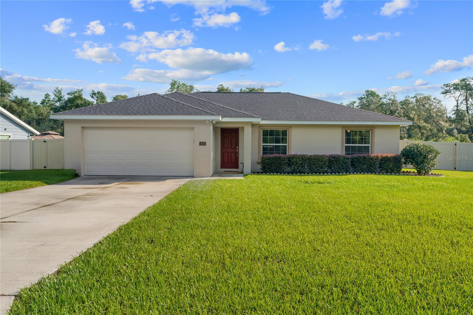 Welcome to this beautiful home located in a sought-after SW Ocala community. With a fantastic lot and a spacious 3-bedroom, 2-bath design, this property features a well-thought-out open concept split floor plan perfect for modern living. The home boasts impressive curb appeal and the back yard is a gardeners dream. The main living spaces showcase tile flooring, complemented by ceiling fans & light fixtures throughout. The primary suite is a true retreat, offering a walk-in closet and a private bath, an inside laundry room, and a convenient 2-car garage. The privacy fenced-in backyard is ideal for pet owners and provides a serene view of mature trees, creating a peaceful outdoor sanctuary for relaxation or entertaining. Schedule your showing today and make this dream home yours!