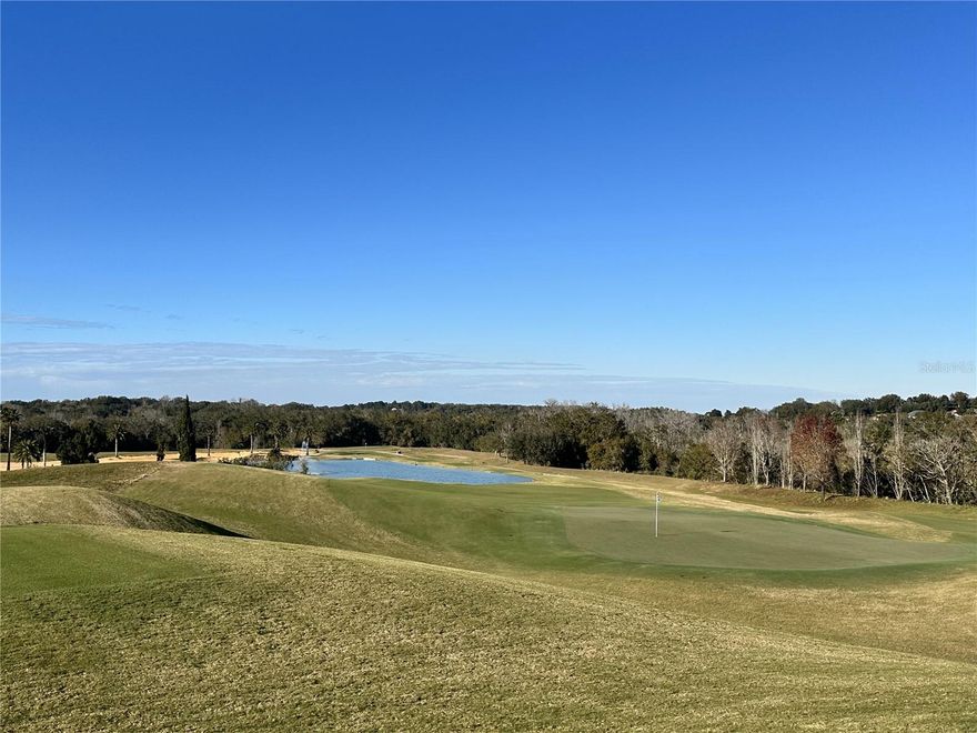 Experience breathtaking long-range views of rolling hills and the championship Nick Faldo-designed golf course from this premium homesite in the gated community of Bella Collina. Ideally situated near the magnificent Clubhouse, residents can enjoy year-round social and culinary events. With no required timeframe to build, take advantage of the rare opportunity to choose from seven distinguished custom home builders when the time is right. Bella Collina offers world-class amenities, including a resort-style pool, state-of-the-art fitness center with 20 complimentary weekly classes, Har-Tru tennis courts, pickleball, multiple dining venues, a luxury spa, a basketball court, and a dog park. Residents also have access to the fishing pier and community boat ramp on scenic Lake Siena. Call today to learn more about this exceptional homesite and the unparalleled lifestyle at Bella Collina! Deferral of the $40,000 Sports Membership Deposit is included by the Developer.
