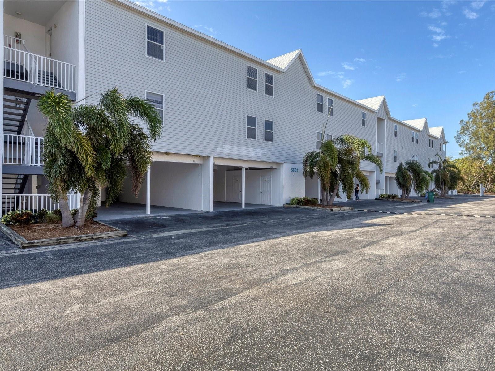 Furnished Annual Rental Available July 1, 2025. Close distance to Holmes Beach! Spacious and bright 2 bedroom, 2 bath condo with Water Views. This amazing unit features a carport and two storage areas. Updated Kitchen & Baths, Laminate floors, and lovely furnishings. Relax and enjoy the Gulf, Preserve & Intercoastal views from the screened balcony. High Ceilings, Granite counters, Stacking washer & dryer in the Kitchen, plus Pantry closet. The Primary Bedroom features a Queen size bed, Walk in closet, and Ensuite bathroom. The second bedroom has twin beds and a large closet. The living room and dining room have views across mangroves to Intracoastal Waterway. Carport is deep with extra storage for beach chairs, bicycles, and more. The community has a Heated Saltwater Pool. Publix shopping center & Trolley stop right across the street. Only 2 1/2 blocks to the Beach. Rent includes water/sewer/trash. No Pets allowed.