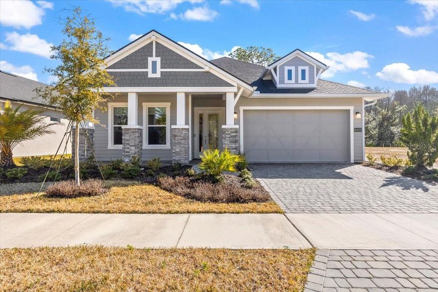 Modern Luxury Meets Serene Privacy in Woodhaven! Better than new and move-in ready, this exquisite Serena II model by ICI Homes was built in 2024 and is perfectly situated on a quiet cul-de-sac near the front entrance of Port Orange's premier gated community. Offering 4 bedrooms, 3 bathrooms, and a private flex office across 2,406 square feet of sophisticated living space, this residence combines designer finishes with thoughtful owner upgrades. Step through the grand foyer to discover an open-concept layout defined by soaring 12-foot ceilings and an abundance of natural light. At the heart of the home, the gourmet chef's kitchen serves as a showpiece, featuring a massive quartz island, luxury stainless steel appliances, 42-inch custom soft-close cabinetry, and a layout optimized for entertaining. The versatile flex room has been enhanced with elegant French doors, providing the perfect private retreat for a home office or bonus space.

The primary suite is a true sanctuary, boasting his-and-hers vanities, expansive walk-in closets, and a layout designed for ultimate comfort. Significant recent upgrades include a new whole-home water filtration system and custom window shades throughout, ensuring this home is as functional as it is beautiful.

Experience the best of the Florida lifestyle on the extended, screened-in lanai. Already plumbed for a future outdoor kitchen, this space offers a private and serene backdrop with stunning lake and preservation views. Whether you are enjoying a quiet morning coffee or hosting a sunset dinner, the backyard provides unparalleled peace and privacy.

Residents of Woodhaven enjoy resort-style amenities including a zero-entry pool, cabana, and playground. Ideally located near top-rated Spruce Creek schools, high-end shopping, and dining, you'll also enjoy quick access to I-95, Daytona Beach, and the Orlando area. Don't wait for new construction! This luxurious, upgraded masterpiece is ready for you today. Square footage received from tax rolls. All information recorded in the MLS intended to be accurate but cannot be guaranteed.