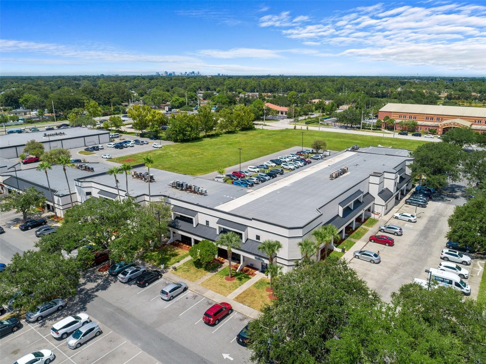 Hoffner Commerce Center is a two-building office/retail park located along the heavily transited South Semoran Boulevard. Boasting over 90,000 square feet of rentable area between the two buildings and an already established diverse tenant mix, it also provides an ideal location for future tenants and visitors.
Recent improvements include an updated lobby and office common areas, as well as a new paint job and a landscaping overhaul throughout the entire business park. Located in Southeastern Orange County, Hoffner Commerce Center offers convenient commuting to and from the site via Hoffner Ave and Semoran Blvd. Semoran Blvd acts as a connection to major roadways such as the Martin Andersen Beachline Expressway (SR-528) and the Spessard L. Holland East-West Expressway (SR-408). These major roads can quickly link you to 1-4 North and South connecting Orlando to other major cities such as Tampa & Jacksonville. The wealth of nearby transportation options helps drivers reach all of Orlando’s major points of interest, like The Orlando International Airport, and Orlando Executive Airport, and less than a 30-minute drive to Orlando’s central business district. Additionally, it is minutes from major big box retailers and grocers such as Walmart, Lowes, and Publix, showcasing the area's attractiveness.