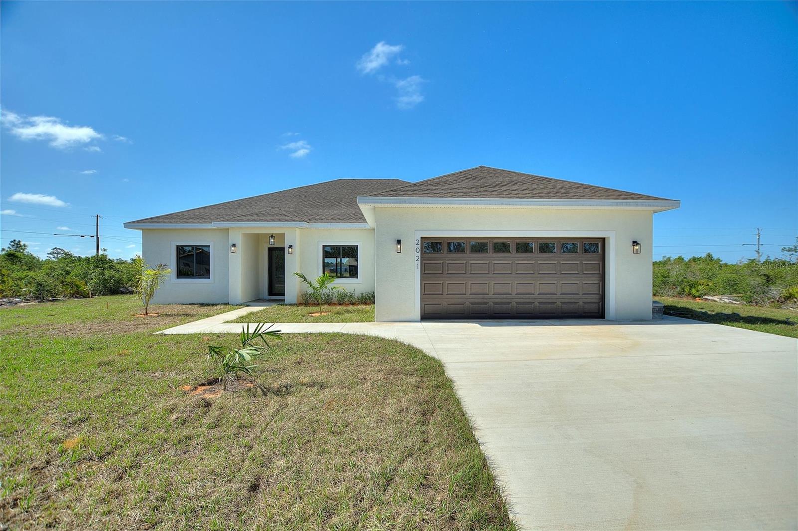 STUNNING NEW CONSTRUCTION HOME in Indian Lake Estates – Golf & Lake Community!***Welcome to your dream home in the serene and sought-after Indian Lake Estates, a peaceful golf and lake community nestled in Central Florida. This beautifully constructed 3-bedroom, 2-bathroom home is ideally situated and just a short golf-cart ride to the community clubhouse and golf course.***From the moment you step inside, you'll be impressed by the over-sized designer-style porcelain tile flooring that flows throughout—no carpet in sight! Tasteful paint color selections inside and out and beautiful fixtures. The thoughtfully designed split-bedroom floor plan offers privacy, while the open-concept living areas create a welcoming space for entertaining and everyday life. The chef-inspired kitchen features elegant quartz countertops, ample cabinetry with soft-close drawers, a convenient closet pantry, stainless steel appliances, and a center island with additional seating. Whether enjoying a casual meal in the informal dining space or hosting guests in the formal dining area near the foyer, this home adapts to your lifestyle.***Relax or entertain outdoors on the under-truss patio just off the spacious great room. The luxurious master suite is tucked away for maximum privacy and boasts a spa-like en suite bathroom with a double-sink vanity, expansive walk-in shower, private water closet, and a generous walk-in closet. Two additional well-sized bedrooms and a full guest bath complete the interior layout.***Beyond your doorstep, Indian Lake Estates offers an unparalleled lifestyle. Enjoy boating and fishing just 10 minutes away at Lake Walk In Water, one of Florida’s premier fishing lakes, home to the state’s longest freshwater pier. Community amenities include an 18 and 9-hole golf course, clubhouse, fitness room, library, tennis and basketball courts, café, post office, marina, beach, playground, and more.***Nature lovers will appreciate the abundance of wildlife, including deer, cranes, eagles, and more. Located about 20 miles east of Lake Wales, and just over an hour to Orlando, Disney, Tampa, and the Gulf Coast beaches, this hidden gem is perfectly positioned for peaceful country living with access to top Florida attractions. Don’t miss your chance to live in Polk County’s best kept secret. Schedule your private tour today!