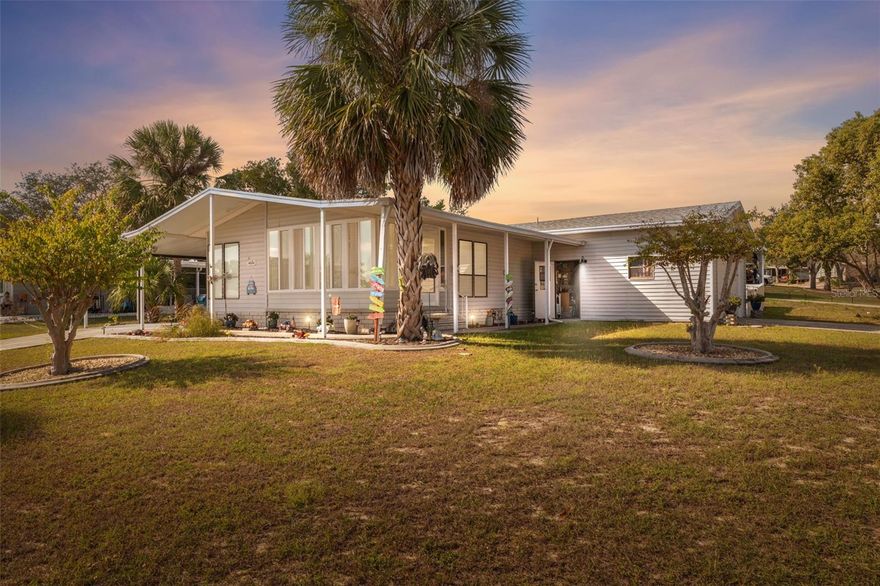 Home available with assumable mortgage at 4.75% interest!!
Welcome to this meticulously maintained and move-in ready 2-bedroom, 2-bath manufactured home located in the gated 55+ community of Brookridge. Built in 1990, this well-kept home offers 1,316 heated square feet and 2,721 total square feet under roof.
Inside, the open and airy living room flows into an updated kitchen featuring ample cabinetry and a built-in coffee bar that adds extra storage and serving space. A bright enclosed sunroom at the front of the home offers a comfortable additional living area—perfect for morning coffee, reading, or entertaining guests. The primary bedroom is generous in size, while the secondary bedroom is also large and versatile. The indoor laundry room includes a utility sink and additional cabinetry for storage and organization.
Situated on a corner lot, this home includes two separate driveways, a rare 2-car garage, and a covered carport. There’s also a separate garage ideal for a golf cart or lawn equipment, plus a screened porch for outdoor relaxation. The vinyl fence (2022) provides privacy, and the roof was replaced in 2018 for peace of mind.
Located in Brookridge, a gated 55+ golf course community offering a clubhouse, heated pool, shuffleboard, and an active social calendar, this home blends comfort, functionality, and community living—all in one move-in ready package.