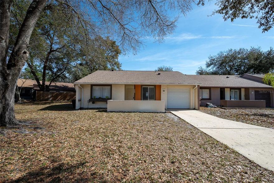 In the lovely community of Hidden Lake Villas you will find this freshly updated one story villa style townhome, on a corner lot. The home has a BRAND NEW ROOF, one car garage, nice screened in patio and fully fenced in yard! The HOA fees are very low and include tennis courts, pickleball and a community pool. Great location off 417 in an established subdivision. This home is move-in ready and has vaulted ceilings, two full baths with tub and walk in shower options. The kitchen offers plenty of cabinet storage, granite countertops.  Not far from both Sanford Airport, Orlando International Airport, within an hour of the Theme Parks and zoned for highly rated Seminole Co schools too. Call for your private showing today!