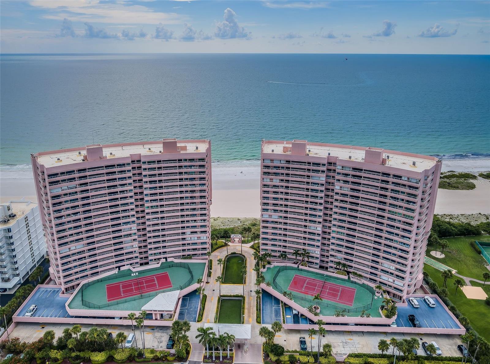 Stunning Direct Gulf front Crescent Beach Club Condo! Experience refined coastal living in this upscale one-bedroom, two-bath condo located directly on the pristine sands of Sand Key, Clearwater Beach. Revel in uninterrupted views of the Gulf of America from your private beachfront balcony, where the turquoise waters stretch endlessly before you. Here you can enjoy awe-inspiring ocean vistas, gentle breezes, and radiant sunsets.The airy living and dining area is flooded with natural light and showcases stunning panoramic water views, providing both a relaxing ambiance and an inviting space for entertaining. Adjacent to the kitchen, a built-in bay window nook with cozy bench seating offers a bright, cheerful setting for coffee or casual meals, perfect for gathering with friends.The kitchen is thoughtfully maintained, featuring solid wood shaker cabinets, Corian countertops, a tiled backsplash, a breakfast bar, and an added buffet area for extra convenience. The breakfast bar creates a seamless connection to the living space, ideal for casual meals and conversation.This residence perfectly blends timeless charm with modern comfort, offering an ideal retreat to create lasting memories.The Gulf-facing Primary bedroom with sliding glass door includes direct balcony access along with primary bath with classic appeal, a large walk-in closet with built-in shelving, and an additional linen closet—providing both convenience and organization. A second full bath near the entryway ensures privacy for visitors and ease of living. Everyday routines are made effortless with a laundry area integrated into the condo, blending practicality with comfort. Crescent Beach Club provides the amenities for a resort-style lifestyle. Other features include Gated community offering 24/7 security, heated saltwater pools & spa (one for each building), tennis, fitness center, billiard room, game room, grilling area, club room and on-site management. Enjoy private Beach Access where the azure waters of the Gulf meet pristine, white sands of the Beach! Easy access to public transportation and airports. This exclusive oasis promises unmatched tranquility and privacy, making it the perfect sanctuary for those seeking a peaceful seaside escape. Immerse yourself in the beauty of dramatic sunsets and let the soothing sound of waves restore your spirit.This exclusive oasis offers unparalleled tranquility and seclusion, perfect for those seeking a serene retreat. This residence is offered as a long term or short term rental.