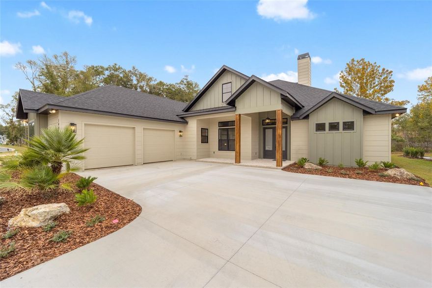 Home is Completed!  The Shawn Lash Signature Home’s Whitmoor Fall 2023 Parade home is located on .26-acre lot in Wimberley, a sidewalk community with luxury, upscale homes situated in a charming setting where curb appeal abounds. This home’s north facing backyard spanning nearly 70 feet across its rear property line, abutting a 25-foot common area AND there is a 10+ acre common area across the street from this executive home...both ensuring for maximum privacy. Shawn Lash, President of Shawn Lash Signature Homes, designed the floor plan to exemplify all that you want from a high end, energy efficient, luxury home that is not only aesthetically stunning, but classic in design. This 2842 sq. foot, 4 bedrooms, PLUS a SEPARATE home office and 3 baths modern home maximizes outdoor living space with a charming rocking chair front porch. Once inside, you will immediately notice the soaring 17.6 ft wood beam ceiling that connects the great room to the kitchen.  The great room has a brick façade fireplace; its stained wood mantle compliments the ceiling wood beams and the floating shelves that flank the fireplace. On both sides of the fireplace are custom cabinets with porcelain tops. Off the great room is the separate home office with its special wood trim wall feature and soaring two story vaulted ceiling.  The chef’s kitchen has hand crafted cabinets topped with amazing porcelain countertops and a large walk-in, hidden pantry. The L shaped return with the cabinetry and countertop separates the dining space from the kitchen. The dining space has board and batten wainscoting, a wall of fixed window that overlook the rear yard, and a three panel sliding glass door. The sliding glass doors separate where they join in the middle, pocketing separately from each other, so the kitchen/dining/family room open completely to the covered rear lanai complete with summer kitchen. All of the living space, including the hallways feature high-end, luxury laminate flooring that will make you think twice you are standing on engineered hardwood floors. The master bedroom occupies the entire left side of the home, complete with his-and-her walk in closets, and an en suite bath with a modern slipper tub separating the individual vanities. Off the rear of the kitchen is the en suite guest room, large laundry room and the convenient stop-n-drop. Off the opposite end of the kitchen and dining space is the second guest room. The 4th guest room, with its closet, could also be used as a flex room/media space. The large covered lanai has a custom built in summer kitchen complete with gas grill and exhaust hood, with cabinetry flanking each side of the grill for storage potential. This lot has a large backyard with a common area behind, which would be perfect for your future pool. Wimberley is a west Gainesville neighborhood spanning over 32 acres where nearly a third of Wimberley is dedicated common area. So much in fact there is plenty of open spaces to enjoy within this sidewalk community. Wimberley is adjacent to the Town of Tioga toward the west, located in the heart of the Jonesville/west Gainesville area right off of the NW 8th Avenue extension. If you’re looking for a true custom home builder, not associated with a franchise, you should consider this Parade Home built by Shawn Lash Signature Homes your forever home!