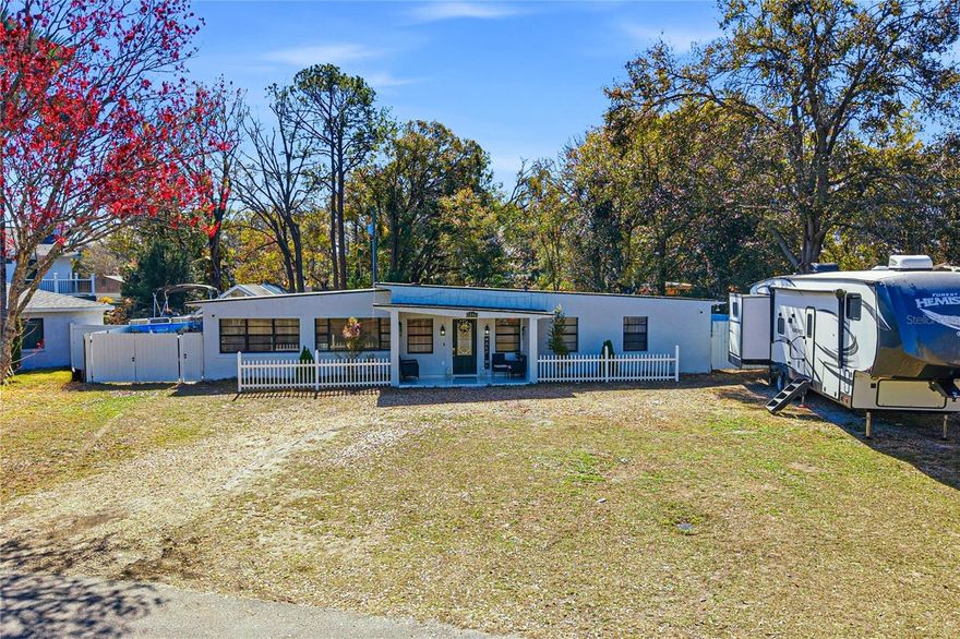 One or more photo(s) has been virtually staged. WOW! This beautifully upgraded 4-bedroom, 3-bath pool home offers stunning panoramic views of the Babe Zaharias Golf Course. Set on a fully fenced 0.27-acre lot, it features new tile flooring, a modern 2025 kitchen with quartz countertops, stainless steel appliances, LED lighting under the cabinets, and custom cabinetry with a wine rack. The luxurious master bathroom was renovated in 2026, and a 50-amp outlet provides convenient RV/EV charging. The flexible layout includes a bedroom with a private side entrance—perfect for an in-law suite, guest space, or rental opportunity. Enjoy a crystal-clear pool with a waterfall, a newly built gazebo, and five storage sheds, including one previously used as an air-conditioned office/beauty studio. Located just 15 minutes from Busch Gardens and Adventure Island, and 20 minutes from Tampa International Airport. Major updates include: ROOF 2022, ELECTRICAL PANELS 2022, A/C 2016, WATER HEATER 2025, and NEWER POOL PUMP. NO HOA. Move-in ready, full of upgrades, and packed with potential—this opportunity won’t last!