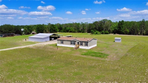 Photo of 9650 Cockatoo Lane, Groveland, FL 34736 (MLS # O6408839)