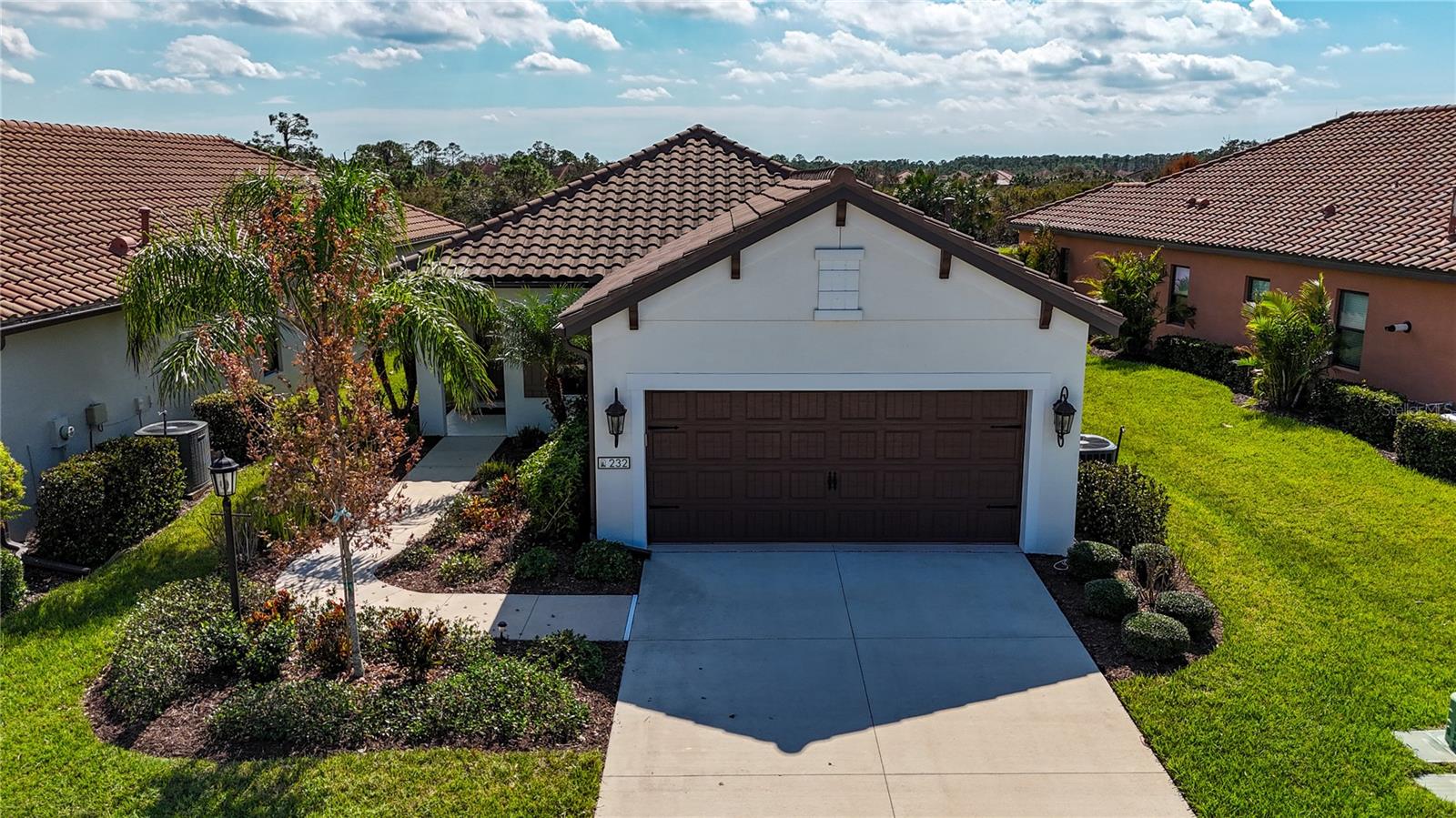 Welcome to 232 Carlino Drive, a stunning single-family home nestled beside the preserve in the serene, lush surroundings of the gated Milano Neal Communities in Nokomis, FL. This elegant residence is ideal for anyone seeking a peaceful retreat with easy access to Downtown Venice/Venice Beach and Nokomis Beach. Located minutes away from shopping, including Publix, CVS, and Starbucks, this home is less than five minutes from the new Sarasota Memorial Hospital in Venice and close to I75 for easy access to Sarasota, Tampa, and Ft Myers. Featuring 3 spacious bedrooms and 2 modern bathrooms, this home is a sanctuary for relaxation and entertainment. The contemporary open floor plan is enhanced by beautiful wood plank-style tile flooring, recessed lighting, and stylish lines that add a touch of luxury to every room. Cooking enthusiasts will love the kitchen, which features granite countertops, sleek charcoal stainless steel appliances, and gas cooking. The beautiful wood cabinetry and wide drawers provide ample storage, complemented by additional closets and a generous laundry room for maximum efficiency. Enjoy Florida's delightful weather on the screened lanai, featuring pocket slider doors that offer a private view of the lake, complete with Florida's natural landscape. The home also boasts a 2-car garage, providing ample storage for your peace of mind. Milano promotes an active and social lifestyle with a robust social calendar and amenities such as pickleball, bocce, a swimming pool, cabanas, a fire pit, and a clubhouse with a fireplace and kitchen. Plus, there's a dog park for your furry friends! With no CDD fees, no capital contribution required to join the HOA, low quarterly fees, and no flood insurance needed, this gem at 232 Carlino Drive is the perfect place to create cherished memories. Don’t miss your chance to make this house your forever home!