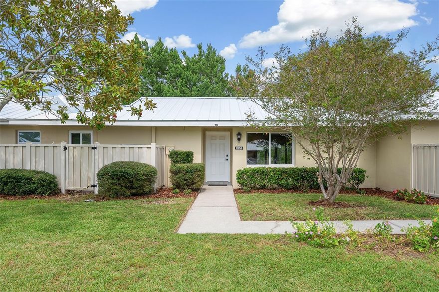 Spacious MOVE-IN READY WATERFRONT CONDO with rare DOCK & BOAT LIFT in the 44 acre sanctuary of The Islands at Dixie Shores! While enjoying the surprise of wildlife all around, gently pass the White Ibis on the front lawn and enter your completely renovated island oasis! Customized by a private contractor, you can gather with friends and family around the brand new classy single-level granite countertops. This home has smart technology, including a NEST thermostat and Lutron lighting system as well.  The gorgeous tile flooring will draw you in, along with the stylish soft-closed cabinets and stainless steel appliances! There is plenty of space in the laundry room for a 2nd refrigerator and extra storage as well. The beautifully updated bathrooms offer spa-like showers and matching granite countertops. Hurricane Helene couldn't hold us down! The brand new sliders that stretch across the sunroom and patio, open up your world to lots of natural light, incredible views and beautiful trees. Just beyond lies the hardy, composite dock, waiting for your boat, water toys and fishing rods! Enjoy direct access to Dixie Bay, Salt River and the Gulf of Mexico. filled with nature's beauties, including manatees, dolphins, fish, scallops, "bird island!," and more! Relaxed living is echoed by the HOA, as their fee includes flood and hazard insurance, lawn maintenance and irrigation, exterior pest control and exterior building maintenance. It also includes cable TV, internet and trash! The corral outside is perfect for your bikes and kayaks too! A new metal roof was installed by the HOA in 2022, and exterior painting was done in 2021. With the heated community pool, tennis courts (pickleball is coming soon!) and a community clubhouse, as well as being minutes away from many shops, restaurants, scalloping, airboat rentals, fishing, kayaking, adventure companies, and swimming with the manatees, you can create lifelong memories whether you live here full time or enjoy it as a vacation home! 4 doors down is a sister condo that is also for sale if you need extra space for family and friends!