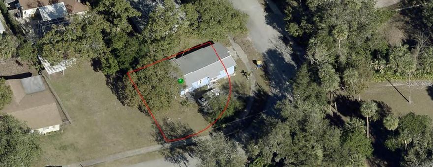 Prime investment opportunity just 6 minutes (2.2 miles) from beautiful **New Smyrna Beach!** Sitting on an expansive corner lot, this property is ideal for investors or builders ready to start fresh. The existing home is a full tear-down—perfect for new construction or redevelopment. With its unbeatable location and strong potential, this is your chance to create something exceptional near the coast!