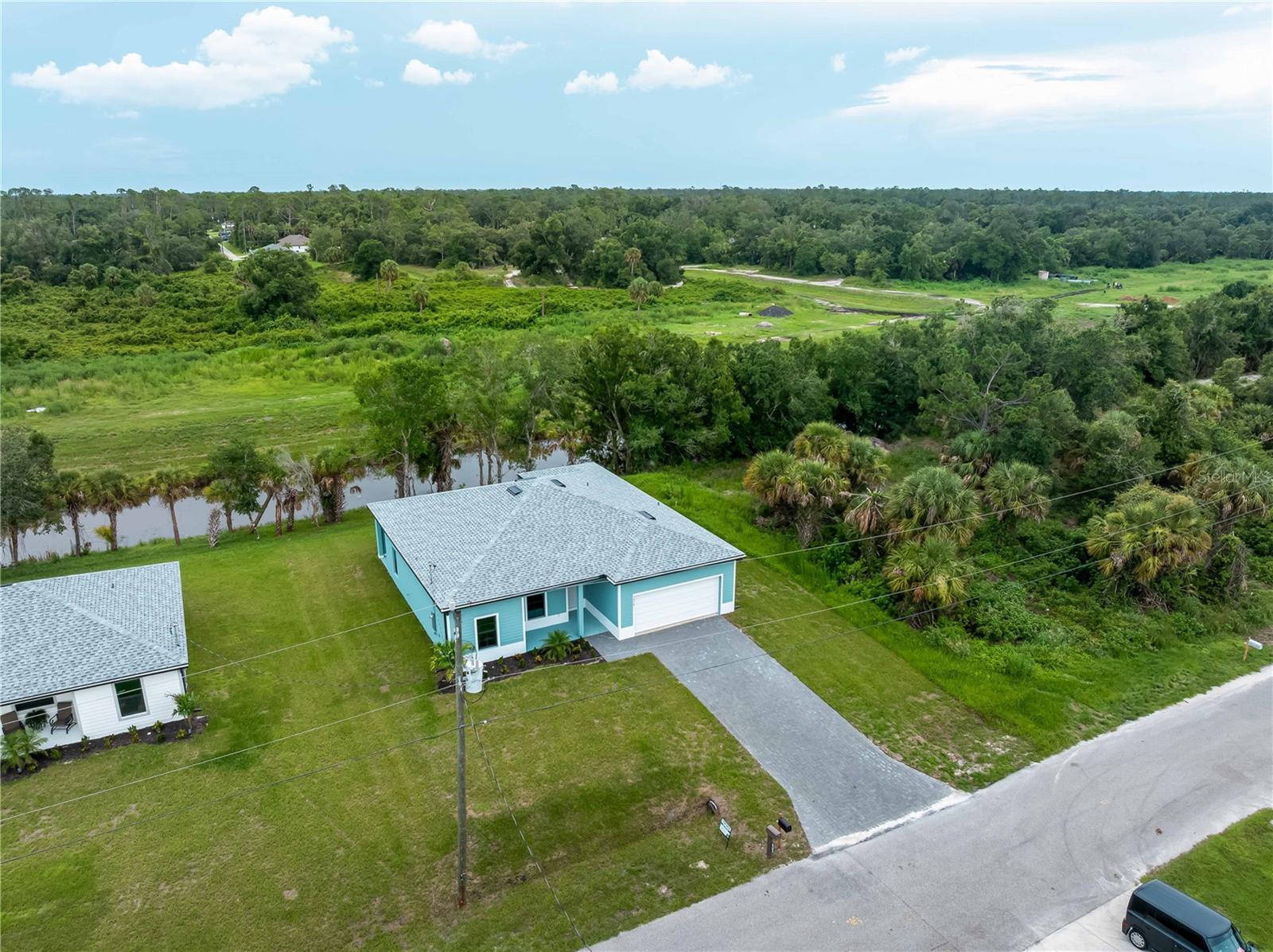Stunning New Construction Home on Canal in North Port, FL!
Welcome to your dream home. This beautiful new construction property offers the perfect blend of modern luxury and serene waterfront living.
Property Highlights:
Prime Canal Frontage: Enjoy direct access to the tranquil freshwater canal, ideal for kayaking, fishing, or simply relishing the peaceful water views.
Whole House Generator Plug: Be prepared for any situation with a pre-installed generator plug, ensuring uninterrupted power during unforeseen events.
Wood-look Tile Flooring Throughout: The home features sleek tile flooring, providing a cohesive and low-maintenance living space.
Kitchen with Quartz Countertops: The modern kitchen boasts durable and stylish quartz countertops, offering both beauty and functionality for your culinary adventures.
Impact-Resistant Windows: Designed with safety in mind, the home is equipped with impact-resistant windows, providing enhanced protection during stormy weather.
Soaring 9'-10' Ceilings: Experience a sense of openness and grandeur with high ceilings that amplify the spaciousness of the home.
Upgraded Finishes: Every detail has been meticulously selected, from premium fixtures to high-quality materials.
Paver Driveway: The aesthetically pleasing paver driveway not only enhances curb appeal but also offers durability and easy maintenance.
Home Warranty: Purchase with confidence knowing the home comes with a comprehensive warranty, providing peace of mind for years to come.