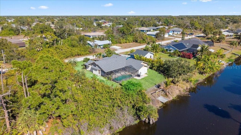 Photo of 11195 Seabreeze Avenue, Port Charlotte, FL 33981 (MLS # TB8488147)