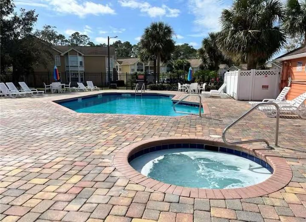 Photo of 2458 Sweetwater Club Circle #22, Kissimmee, FL 34746 (MLS # S5136235)