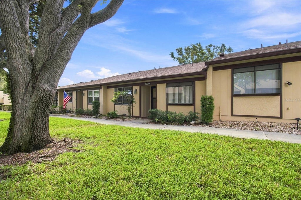 Photo of 11231 Dollar Lake Drive #4, Port Richey, FL 34668 (MLS # TB8546833)