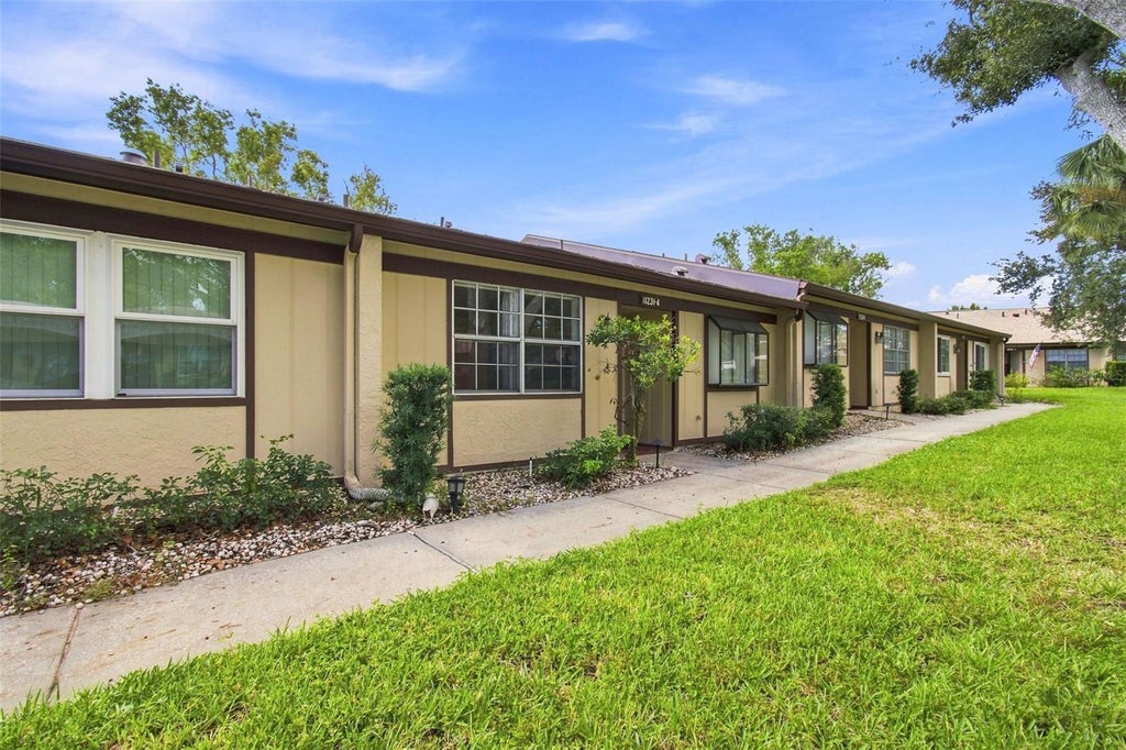 Photo of 11231 Dollar Lake Drive #4, Port Richey, FL 34668 (MLS # TB8546833)