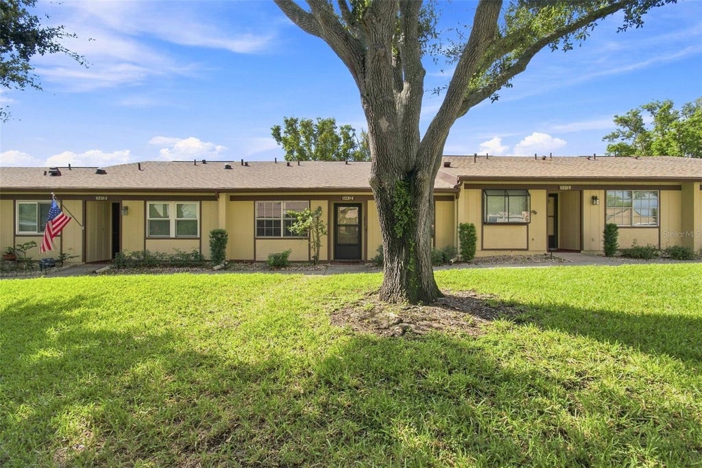 Photo of 11231 Dollar Lake Drive #4, Port Richey, FL 34668 (MLS # TB8546833)