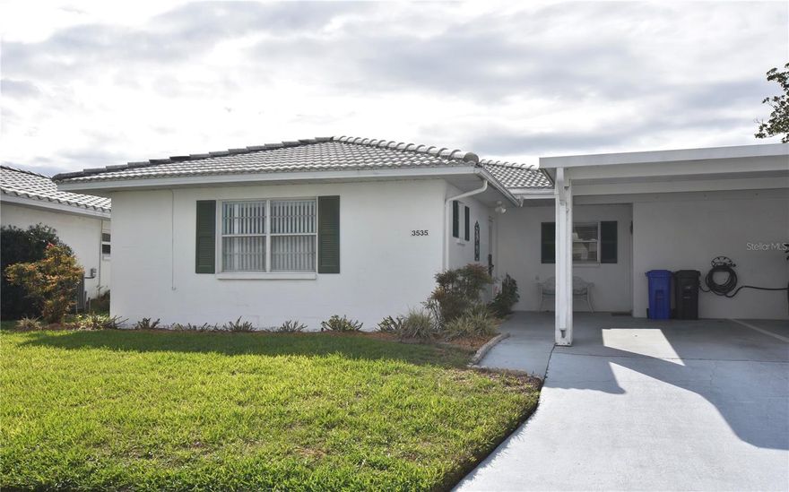 Welcome to Imperial Southgate Villas Condominium, a beautiful all-ages community nestled in the heart of Central Lakeland, Florida. This charming and spacious single-floor residence offers comfortable, low maintenance living in a highly desirable location. The home features two bedrooms and two full bathrooms, a convenient carport, and an attached sunroom - perfect for relaxing or entertaining year-round. The thoughtfully designed layout provides generous living space.  Residents enjoy easy access to nearby amenities, including the private Scott Kelley Villa Club and the Kelley Recreational Complex. Additionally, you'll find a variety of restaurants, shopping centers, and fitness facilities just moments away, making this location as convenient as it is inviting. Experience the perfect blend of comfort, community, and accessibility in this well situated Lakeland property.