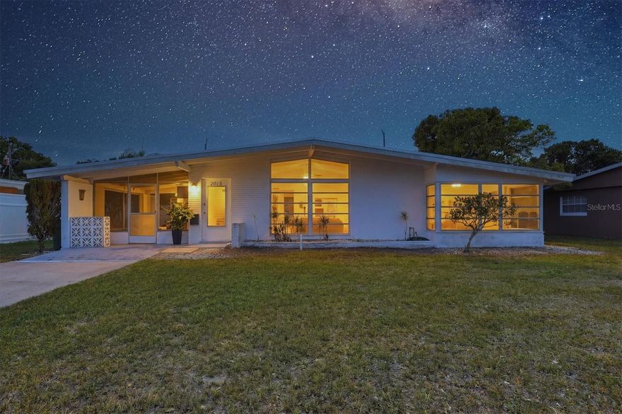 KENSINGTON PARK where we have NO HOA rules AND NO HOA FEES! LOCATION, LOCATION, LOCATION...Near UTC, shopping, downtown, beaches and I-75! BONUS: you have a new park/playground was just installed on 27th Parkway.  Check out the contemporary A-Frame style home with Cathedral (high) ceilings throughout AND Transom windows letting the morning sun in! The 2 bedroom, 2 bath home has an addition that could easily be converted into a PRIMARY & 3rd BEDROOM WITH PRIVATE BATH AND 2 SEPARATE EXTERIOR ENTRANCES AND COULD ALSO BE TURNED INTO A 1 BEDROOM APARTMENT but still part of the main home access. HOW ABOUT A NEW METAL ROOF and NEW 200 AMP ELECTRIC PANEL plus A NEW ELECTRIC POLE? The washer and dryer are only one year old and most other appliances are 13 years old. TWO of the exterior doors are scheduled to be replaced and on special order now...paid for by the owner/seller. The carport has been converted into a covered/screened lanai. The HVAC ($6400) was installed in 2022 and the Sewer lines replaced in 2013 ($7,800)! COME STEAL THIS HOME TODAY for $325,000!