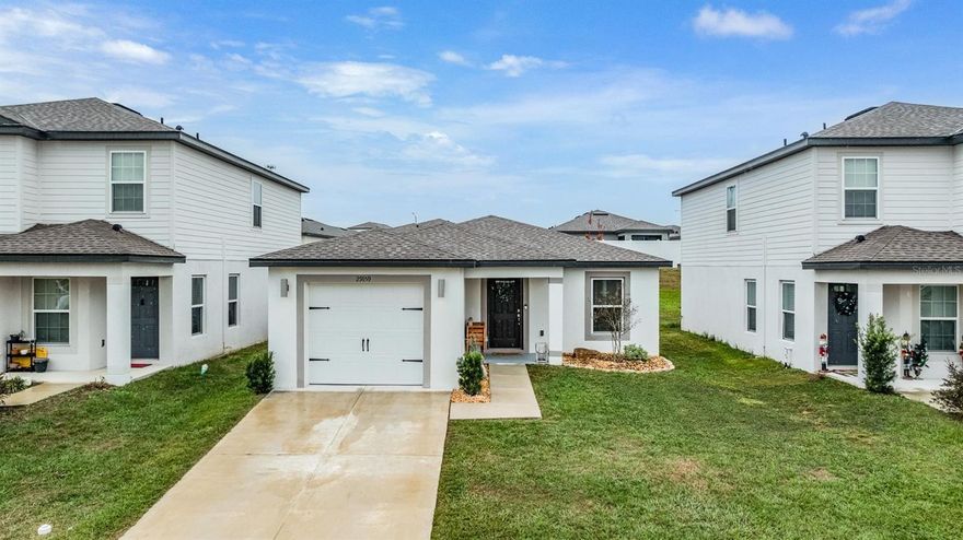 One or more photo(s) has been virtually staged. Welcome to 29159 Fedora Circle, a beautiful move-in ready 3-bedroom, 2-bathroom home with 1,284 sq ft of living space located in the desirable Trilby Crossing community in Brooksville. Built in 2023 by LGI Homes, this charming Hibiscus model floor plan features a 1-car garage, a thoughtfully designed open-concept layout, and a stylish CompleteHome™ interior package. Enjoy modern finishes throughout, including beautiful wood-look luxury vinyl flooring, sleek white shaker cabinetry, granite countertops, and stainless steel appliances in the spacious kitchen. The split floor plan offers privacy, with a large primary suite featuring a walk-in closet and an en-suite bathroom with a step-in shower. The bright and airy living and dining areas flow seamlessly into the kitchen, making it ideal for entertaining. Step outside to a covered patio and backyard with no direct rear neighbors—perfect for relaxing outdoors. Additional highlights include energy-efficient windows and a laundry room located inside for convenience. The community has low HOA fees and is close to I-75 for easy commuting to Tampa, shopping, and dining. Don’t miss the opportunity to own this newer home in a growing community. Schedule your private showing today!