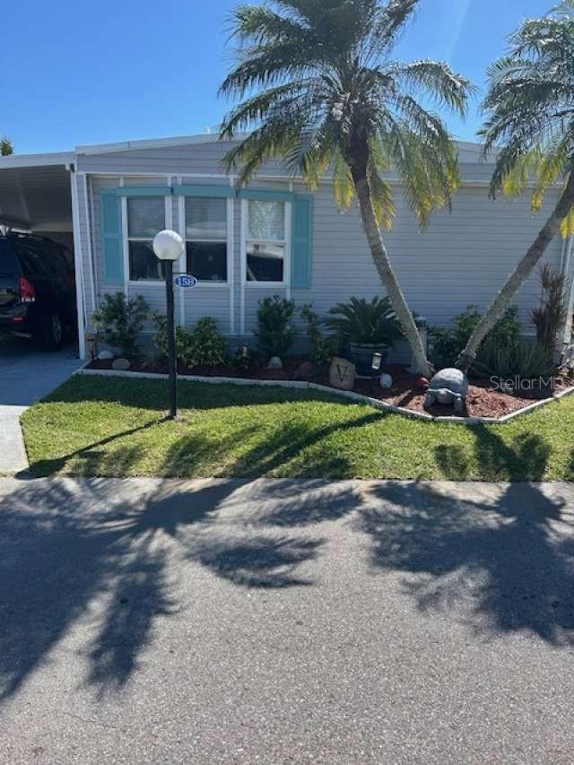 Welcome to 158 Bermuda Way, located in the community of the Lazy River Village in North Port, one of the fastest growing communities in FLORIDA. Lazy River is a hidden treasure –"just the right size, with just the right people". With a beautiful unobstructed view of the Myakka River, this charming property brings pleasure to all. You will find a large backyard lot with a good-sized private boat dock where you can watch the amazing sunset every evening! This brightly renovated home comprises 2 bedrooms, 2 full bathrooms and new flooring throughout. This amazing retreat hosts an open concept - kitchen/great room area with custom granite countertops and GE PROFILE fridge/freezer and double oven. The large, screened lanai includes a storage/laundry room with front loading washer and dryer. An extra-large overhead shelving unit allows for plenty of storage. Roof and carport replaced 2023/2024.
Lazy River Village is a 55+ community of 356 homes nestled in the Myakka River in Sarasota County, Florida. Owners can also rent slips in the 38-dock Lazy River Marina which also promotes two kayak/canoe racks. Additionally, there is a storage yard for boats, trailers and RVs. LRV has a very active boat club which hosts many extra activities throughout the year.
Although, a smaller community by today’s standards, there is more than enough to do within the parks 79 acres! You can fill your days relaxing by the pool, taking your boat over to the local restaurant for a bite to eat with friends or joining them for pickle ball or fitness classes. A low HOA ($279/month) includes cable tv and internet, lawn maintenance and access to all amenities as follows: • Gym - complete with treadmills, bikes, ellipticals, stationery equipment and a full scale of weights, etc. • Pool & separate hot tub • Large Clubhouse complete with fully operational kitchen, a stage which hosts shows of all kinds and a dance floor • Fully stocked library complete with games of all kinds • Large private meeting room for groups and card games • Billiards and table tennis • Wood shop • Shuffleboard • Pickleball & Tennis • Cornhole • Bocce Communities with special attractions nearby: Venice – 10 miles Sarasota – 34 miles Sanibel Island – 79 miles Ft. Myers – 48 miles Tampa – 84 miles Naples – 88 miles Orlando – 154 miles