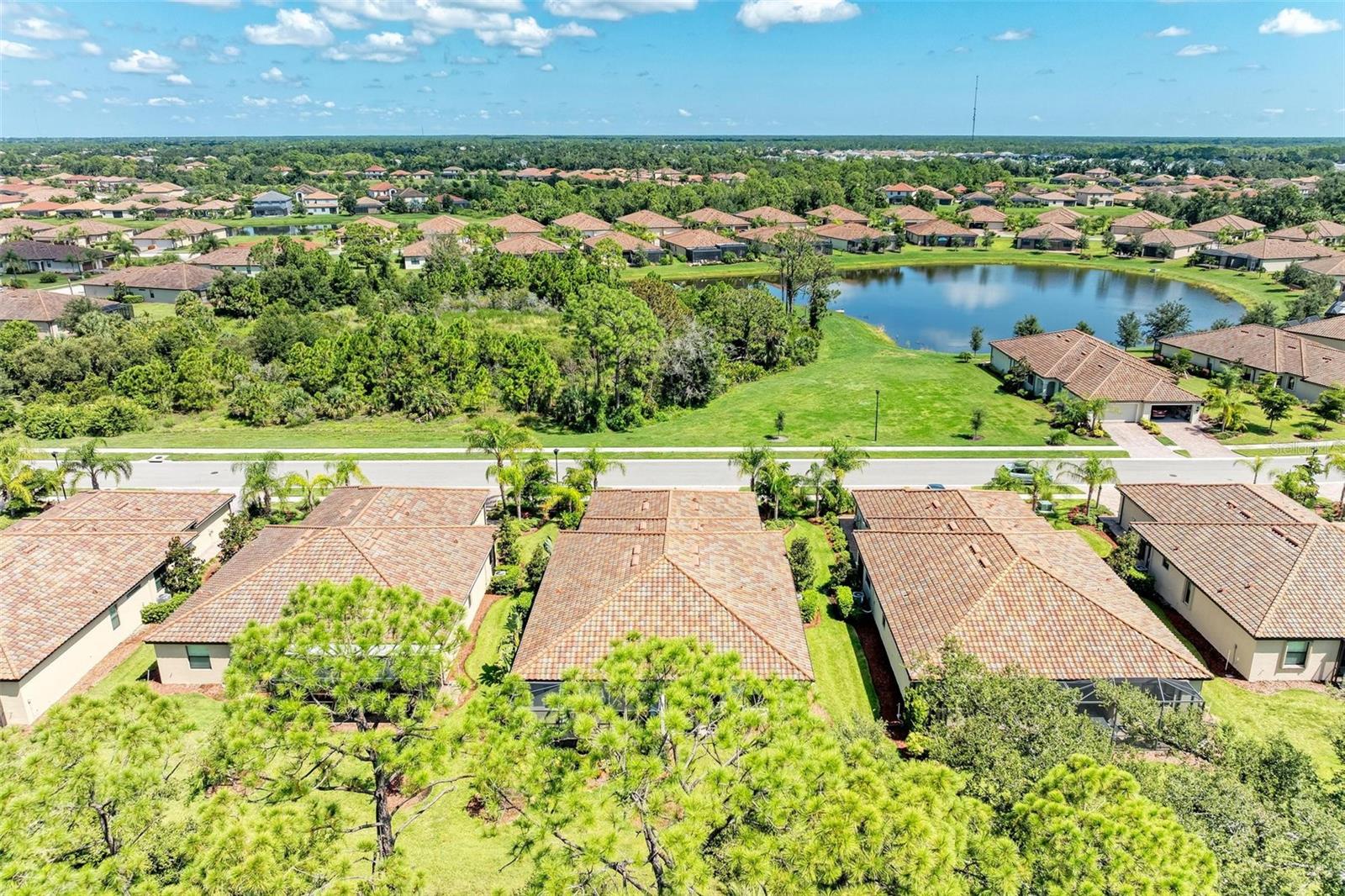 Discover luxury living located within the prestigious Gran Paradiso community of Wellen Park. This meticulously maintained 2-bedroom, 2-bath home plus a versatile den almost 2200sf under roof offers both comfort and sophistication. Step inside to find an open-concept split bedroom layout adorned with crown molding, tall ceilings , upgraded luxury vinyl flooring in all bedrooms including den, no carpet, and upgraded lighting fixtures. The gourmet kitchen features granite countertops, stainless steel appliances with brand new refrigerator, spacious pantry and a spacious tiled breakfast bar, perfect for entertaining. Retreat to the expansive master suite, complete with his-and-hers closets, dual sinks, a walk-in shower, and a separate soaking tub—your private spa-like escape. Outside, a tranquil screened lanai invites you to unwind and soak up the Florida sunshine with preserve for extra privacy and screened in front porch with the beautiful lake view to enjoy!The home also provides hurricane resistant shutters, Brand New 2024 Water heater, rain gutters, and a laundry room off the 2 car garage with Washed and Dryer Included providing functionality and peace of mind. Even Golf Cart included as a gift for you to enjoy your florida lifestyle! Enjoy your Resort Lifestyle at Gran Paradiso! Gran Paradiso is a guarded and gated, master-planned community offering world-class resort-style amenities: Grand Clubhouse – A luxurious 20,000 sq. ft. clubhouse with a state-of-the-art fitness center, sauna, steam room, and activity rooms. Expansive Resort Pool & Spa – Take a refreshing dip in the zero-entry heated pool and spa, surrounded by lush landscaping. Tennis & Pickleball Courts – Stay active with lighted courts for year-round play.Walking & Biking Trails – Enjoy miles of scenic paths winding through nature preserves and picturesque lakes. Social Calendar – A vibrant community offering yoga, card games, group outings, and seasonal events. Low-Maintenance Living – HOA fees include cable, all lawn care including mowing, pruning, mulching, weeding, exterior maintenance including paint every 7 years as well as roof replacement, and more! With Wellen Park’s charming shops, restaurants, and entertainment just minutes away, this home is a rare find in one of the most sought-after communities in Southwest Florida. And three Beautiful Beaches within 8 miles radius! Call to schedule your private tour today and enjoy your Florida Living at its best!