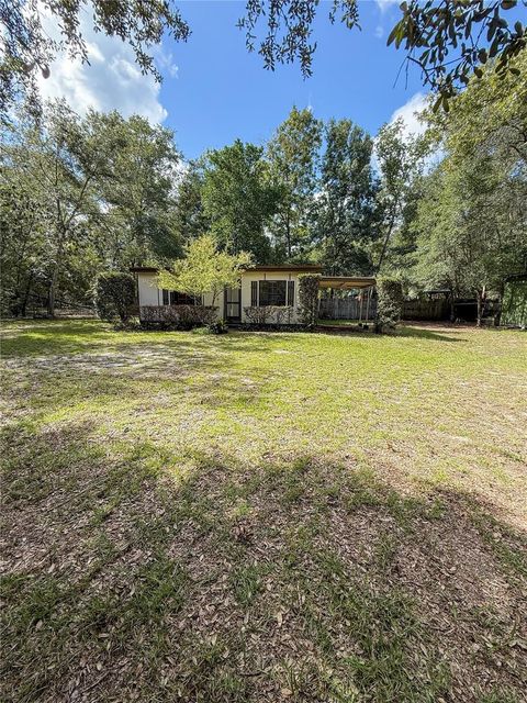 Photo of 19412 SE 91st Place, Ocklawaha, FL 32179 (MLS # OM709021)
