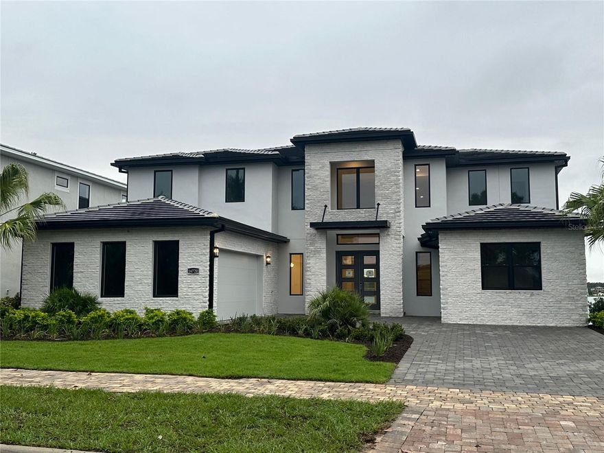 The beautiful Corbeil Mediterranean's welcoming covered entry with double-doors reveal the two-story foyer and beautiful formal dining room. The spacious great room with coffered ceiling and desirable covered lanai overlook the sparkling pool and fire pit. A well-designed kitchen adjacent to a bright casual dining area features a large center island with breakfast bar, plenty of counter and cabinet space, ample walk-in pantry, and butler pantry to the dining room. The private primary bedroom suite is highlighted by dual walk-in closets and deluxe primary bath with dual vanities, freestanding tub, large luxe shower. Central to the generous loft are the secondary bedrooms featuring sizable closets and baths.