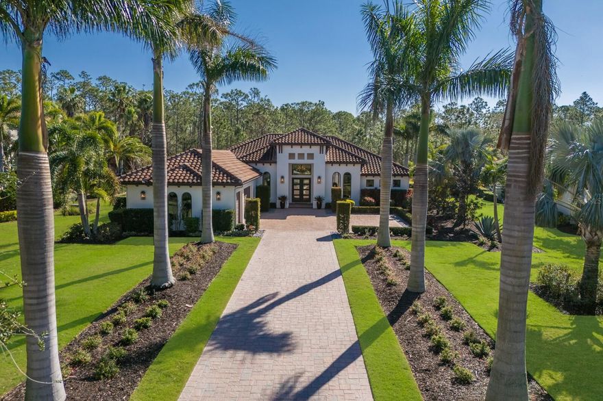 Make your way down the long paver drive lined by dramatically uplit Royal Palms and meticulously manicured grounds that stretch across more than three-quarters of an acre. 19424 Ganton Avenue stands in the distance, a masterpiece of design and luxury, framed by the towering presence of Florida pines and ancient 200-year-old oaks in the backdrop. This stunning contemporary home is filled with the finest finishes yet has comfort and family in mind. The grand room makes a statement from the moment you enter with soaring ceilings, professionally styled interiors, custom trim work, built-ins, crown mouldings, a linear fireplace, and bespoke lighting. 10-foot-high by 22-foot-wide pocket sliding doors offer an unobstructed view of the nature outside. Impact glass protects the entire home from the outside world, but within, the ambiance is filled with tranquility and refinement. The gorgeous kitchen makes a statement in this residence boasting gas Thermador appliances, fine custom cabinetry with soft-close drawers and pull-out shelves, dramatic quartz countertops, and a massive island which serves as a gathering spot for family and friends. Glass-front cabinets illuminate from within to showcase your family's most important pieces and a 10-foot-tall glass-enclosed dual-sided wine display, is a showpiece that reveals your carefully selected vintages. Throughout the house, every detail is a testament to the homeowners' desire for perfection.  The primary suite is a luxurious retreat with access to the lanai, two custom-organized walk-in closets, a spacious marble vanity, crown molding, a large pass through shower, and a free-standing tub. The office features tall arched windows, high ceilings, and glass doors. Each of the two guest bedrooms have generous closet space and en-suite bathrooms. The bonus room, just off the great room, opens directly to the expansive covered lanai, where the true luxury of this home comes to life. The travertine deck stays cool in the late afternoon sun and surrounds a salt water pool and spa. The substantial summer kitchen—equipped with a granite-topped island, Blaze professional grill, Marvel outdoor fridge, prep sink, and a massive vent hood—welcomes outdoor dining and entertaining. It is in the tranquility of the fully fenced backyard, however, where the true drama unfolds. The serenity of the surroundings, the beauty of the perfectly curated landscape, sculpted hedges, and the majesty of the unspoiled 60+ acre forest all combined to create a rare kind of peace that is not easily obtained.  Bordering Lakewood Ranch, residents of the Concession enjoy all of the activity in and around the area but enjoy no CDDs, more spacious estate lots, a high security guard gate, and optional membership to the Concession Golf and Country Club. The Concession was home to the 2021 PGA Tour World Golf Championship and the 2023 PGA World Champions Cup, is the selected host of the 2026-2028 Senior PGA Chamionships, and is known as one of the most prestigious golf communities in the country .