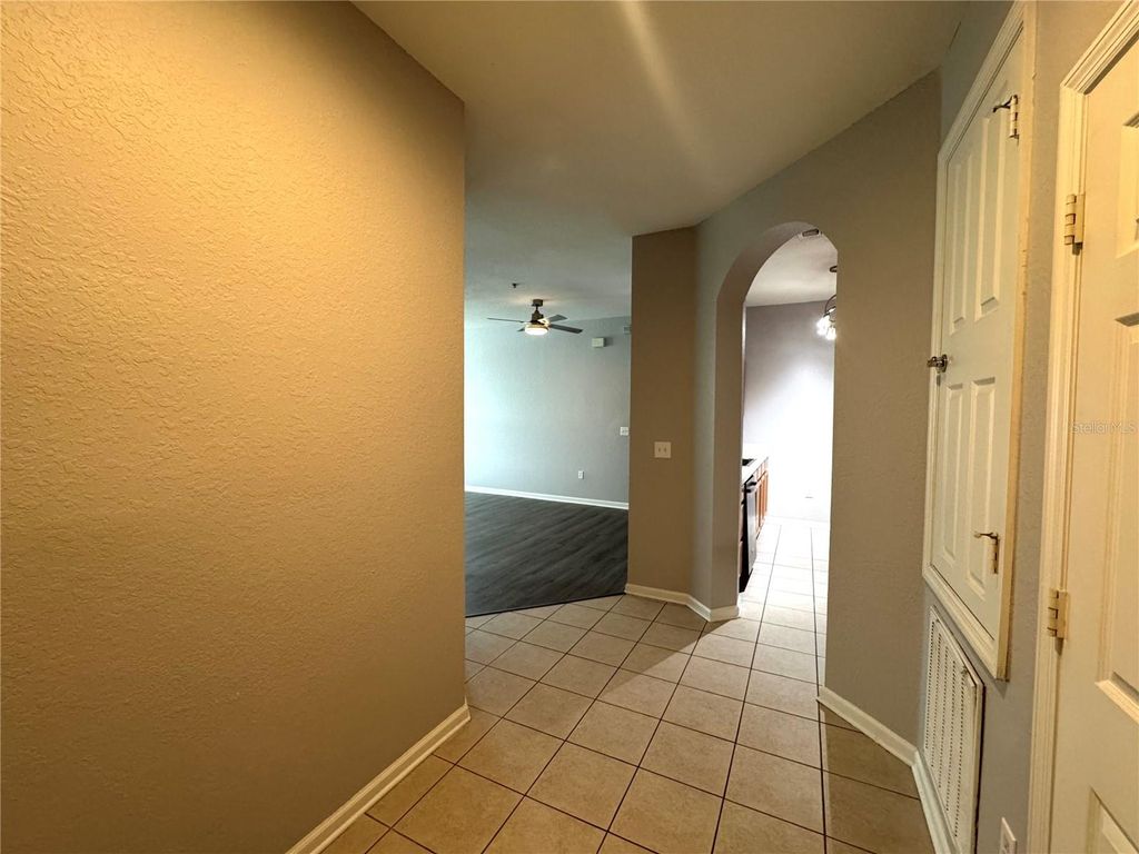 Photo of 8660 Buccilli Drive #305, Orlando, FL 32829 (MLS # O6393402)