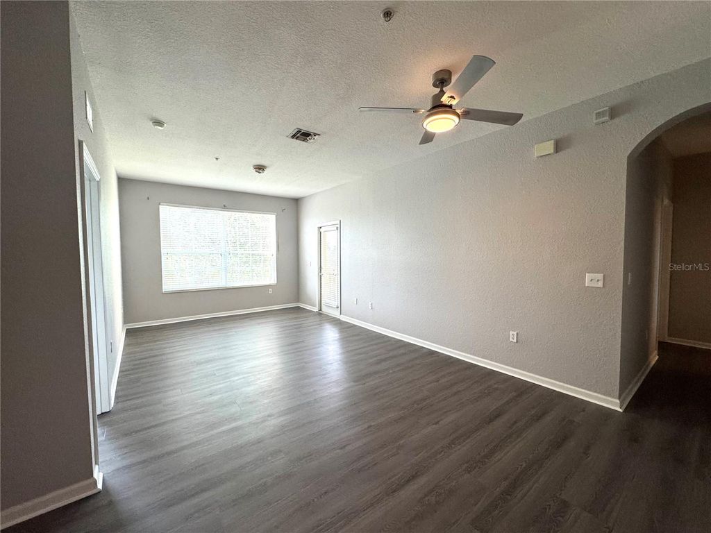 Photo of 8660 Buccilli Drive #305, Orlando, FL 32829 (MLS # O6393402)