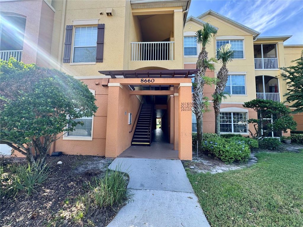 Photo of 8660 Buccilli Drive #305, Orlando, FL 32829 (MLS # O6393402)