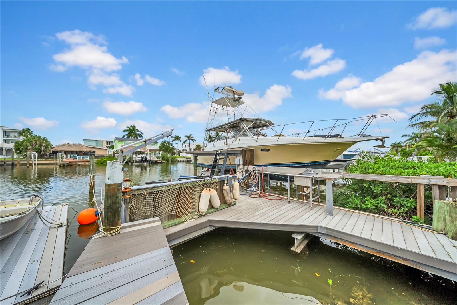 This is the best priced move in ready waterfront home on Pinellas county's Gulf Coast, priced well below comparable properties. The property was NOT substantially damaged and was meticulously designed by a disaster relief specialist, this home stood strong through last year’s hurricanes while others around it didn’t. That peace of mind is priceless, why buy a house on the water you'll have to do extensive renovations to and deal with FEMA's 50% rule when the home you never thought you'd find is right here? Inside, you’ll find 2 bedrooms and 2 full baths, each with an en suite bathroom, with one of the bedrooms tucked behind a hidden bookshelf wall (the kind of detail you show off to your friends). The chef’s kitchen was designed for serious cooking with a restaurant grade range hood and prep stations. Natural light pours into the living room through a skylight, while upgrades like brand new plumbing, a roof built to last 50 years, and new AC systems mean zero major projects. Step outside to your waterfront paradise where you'll find a 2017 dock built with aluminum I beams and concrete pilings, Trex decking, and a 24,000 lb lift with new hydraulics. You could convert the extra family room/office space to a 3rd bedroom if desired. Aggressively priced to sell quickly, deals like this don't hit the market often.