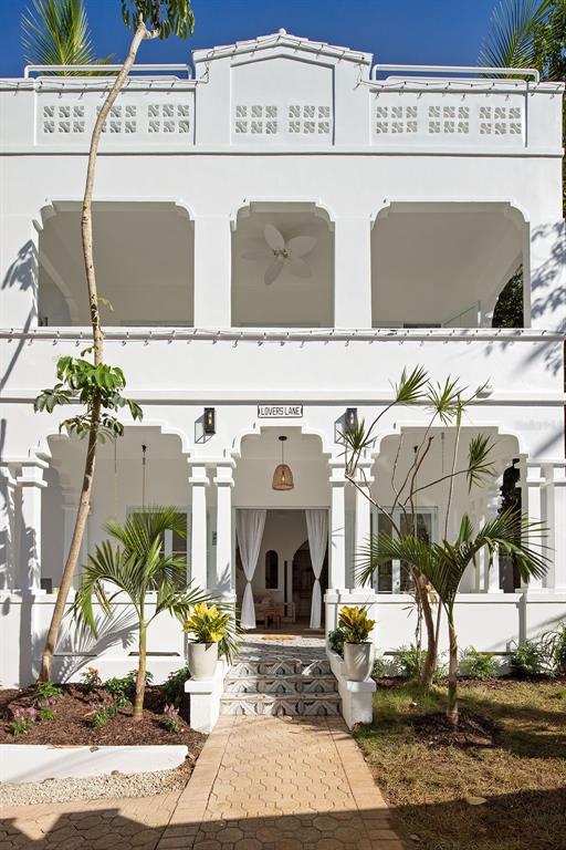 A stunning and spacious newly remodeled residence in Condado! This grand home, with unique architectural features, has been given a complete makeover. Sold completely furnished and equipped.
The main floor of the home is open living, kitchen, and dining areas that open onto patio gardens and the pool. The second floor has three bedrooms, two bathrooms, and an enormous master suite with private balcony. The third floor has two more bedrooms and a large entertainment space that opens on to the rooftop. The property also has a fully furnished 2 bedroom apartment with a private entrance that can be used as a guest house, home office/gym, or rental investment.
Located on a quiet street just around the corner from restaurants, shopping, the beach, and two of the best private schools in Puerto Rico.