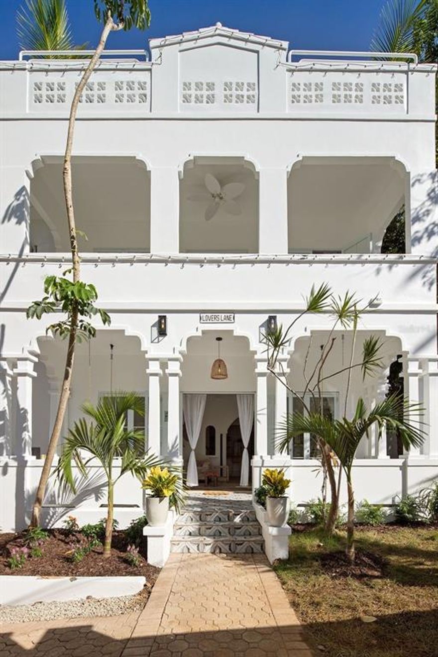 A stunning and spacious newly remodeled residence in Condado! This grand home, with unique architectural features, has been given a complete makeover. Sold completely furnished and equipped.

The main floor of the home is open living, kitchen, and dining areas that open onto patio gardens and the pool. The second floor has three bedrooms, two bathrooms, and an enormous master suite with private balcony.  The third floor has two more bedrooms and a large entertainment space that opens on to the rooftop.  The property also has a fully furnished 2 bedroom apartment with a private entrance that can be used as a guest house, home office/gym, or rental investment.

Located on a quiet street just around the corner from restaurants, shopping, the beach, and two of the best private schools in Puerto Rico.