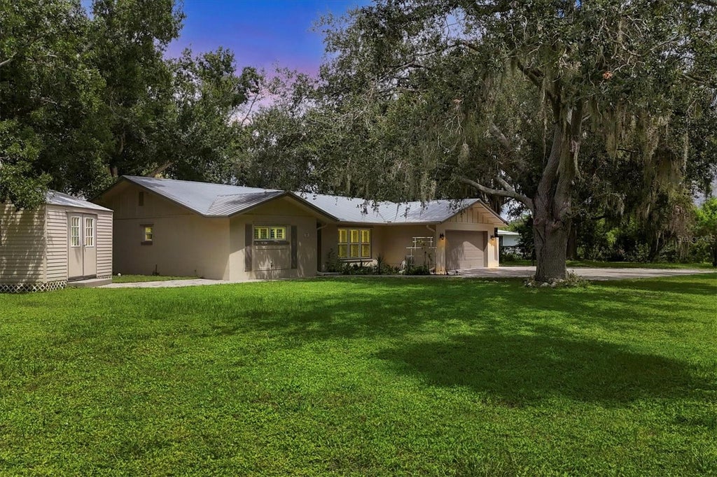 Photo of 336 Timbruce Lane NW, Port Charlotte, FL 33952 (MLS # N6146046)
