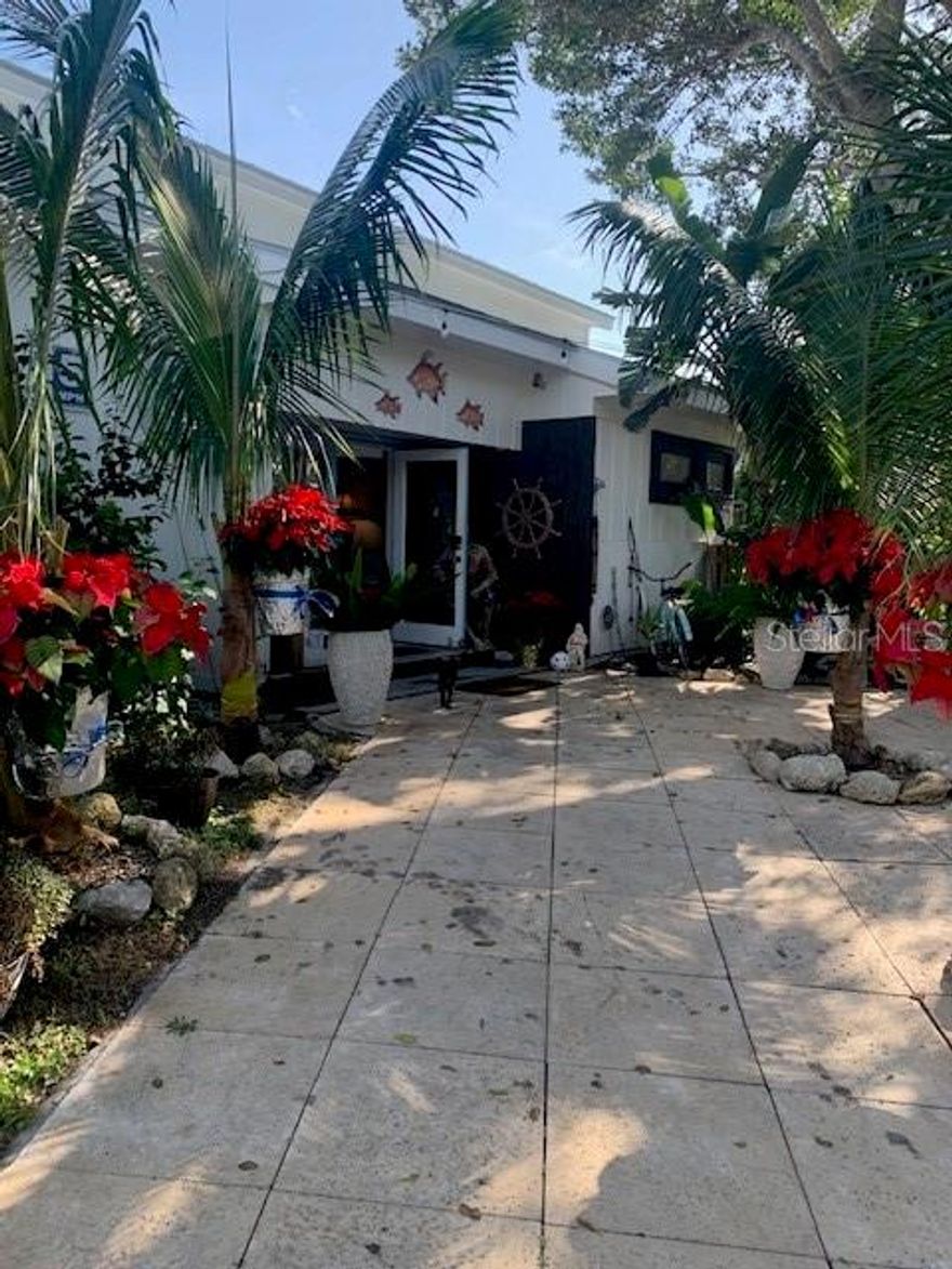 A Rare Opportunity on North Siesta Key – 350 Feet of Waterfront!
Discover this unique single-story property on Bay Island, offering both beauty and potential. High and dry, the home remained unaffected by recent storms, with 4–5 feet of elevation to spare. Set on a tranquil, tropical lot, this historic location on Garden Lane—once home to the Siesta Key Fish Market—is truly a boater’s and fisherman’s paradise, just steps from Shell Beach and its breathtaking sunsets.
The property features a classic Florida ranch-style 4-bedroom, 2-bathroom home with a pool, large deck, and lush backyard designed for entertaining, plus a detached 2-bedroom, 2-bathroom guest house. Whether you choose to renovate, rebuild, or divide the lot (buyers to verify with the City), the possibilities are endless.
All this just minutes from world-famous Siesta Key Beach, The Village shopping, dining, and nightlife, and vibrant downtown Sarasota.