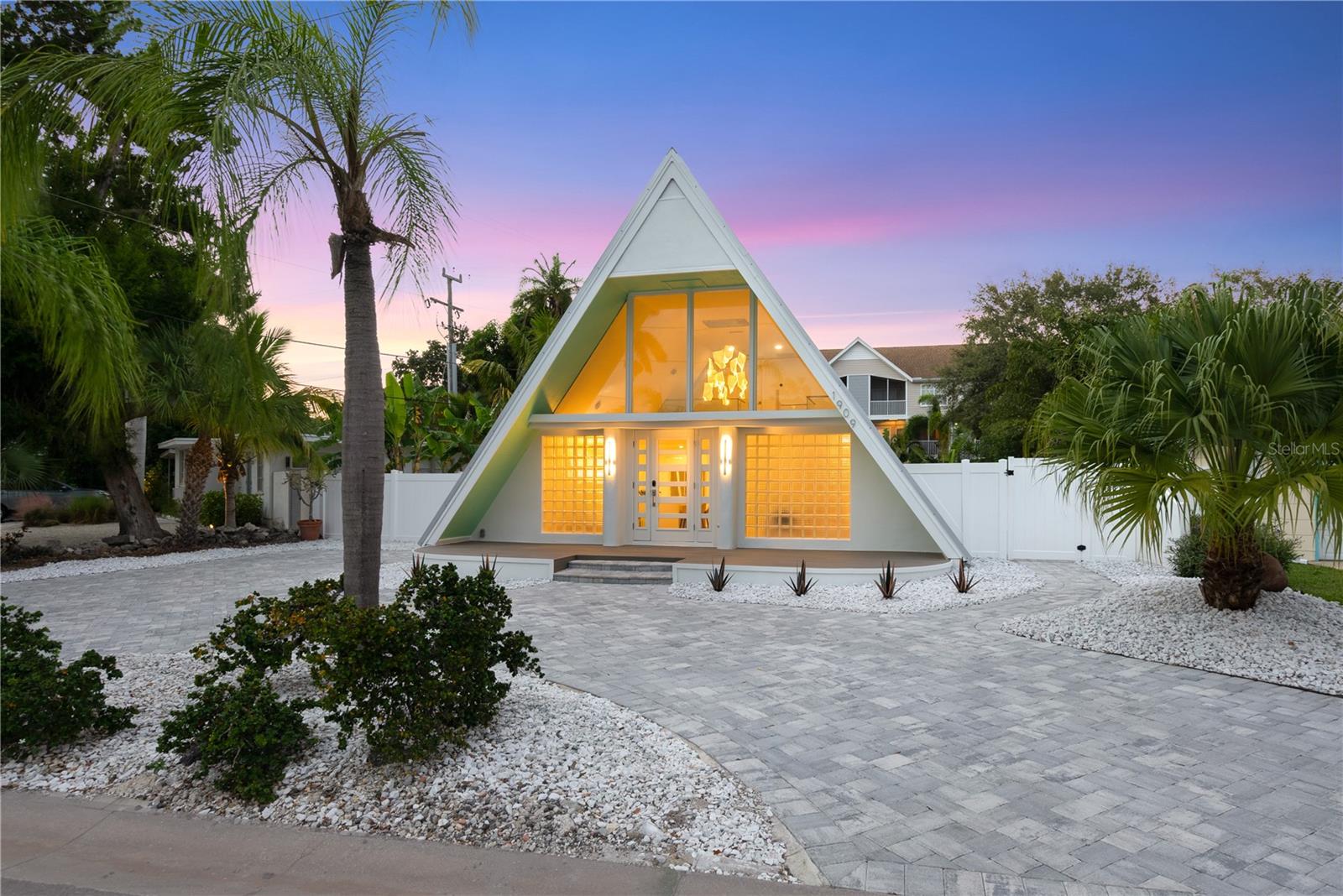 Situated West of Trail, one will enjoy this bright, newly renovated unique pool home on a street with mostly waterfront homes featuring 3 beds & 3 baths, plus an office area that could be used as a 4th bedroom and offers a nice leather pull out sofa. If another office space is needed, there is an additional loft space outside the primary suite. The main living area features Bosch appliances, artful light fixtures, a large island with seating, dining space and high ceilings. Other features are large front porch deck space, interior laundry, artificial turf with grill area, and fully fenced in yard with heated pool offering a water feature. All utilities included. The home is central to & minutes from Siesta Key, St. Armand's Circle/Lido Key, downtown and more. Walk to the Sarasota Arts Museum, grocery store, Southside and downtown Restaurants & shops, Selby Botanical Gardens, Bayfront Park & Marina Jack. Rents are as follows: August-October: $7,900/mo, November-December: Inquire with exact dates, Jan and April: $15,000/mo, Feb and March: $19,900/mo, May-July: $12,000/mo. Weekly rentals allowed and will be prorated