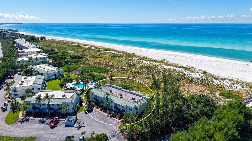 WOW! The minute you open the front door of this first floor Coastal Retreat Seaside condo, you will be captivated by the shimmering, turquoise Gulf of Mexico Water View and the Panoramic Sandy White Beach in front of you. You'll be eager to get a closer look from the glassed in Florida Room, so you may overlook the beauty of this updated, attractively furnished & decorated first floor residence at Sea Pines, a small  28 unit beach front condo complex on the north end of Longboat Key, Florida. Since purchasing five years ago, these owners have lovingly transformed this almost 1400 square foot, corner unit with extra windows, open concept, two bedroom with En Suite baths & walk in closets to today's coastal contemporary style tastes. Improvements include light oak color Luxury Vinyl wide plank flooring throughout, Samsung stainless steel appliances including washer & dryer, new HVAC installed, updated the primary bedroom with a quartz counter vanity, tiled & glass door shower, and fitted out closet.  The condo's interior was painted as well & new, high quality neutral colored living room, dining & bedroom furniture, rugs, lighting & drapery, artwork and a large entertainment center installed. A new tiled roof was installed on this building in 2024. Additional features include impact resistant windows in both bedrooms & the office adjacent to the
kitchen. Plantation shutters cover all these windows. This office area is fitted out with oak cabinetry, desk & drawers, perfect for working at home. The spacious 26-foot-long lanai (Florida Room) can be entered from either the primary bedroom or the living room via sliders. This may be your favorite room with mesmerizing Gulf & beach views over the sea grass pathways to the water. And of course, the magnificent Longboat Key Gulf of Mexico sunsets will thrill you whether watching from your lanai or enjoying on the beach while toasting your good fortune! This turnkey handsomely appointed & attractively furnished seaside retreat offers great rental income if you so wish. There is the potential of keeping on an existing three month (Jan., Feb. & March 2026) tenant. Currently these owners are using RVA Rentals, but a new owner can choose how or if to lease out this unit. Rental friendly Sea Pines can be leased out six times a year with a one month minimum time period. Two additional benefits to this first floor Unit 14 are that these owners have paid $5357 assessment for new landscaping for the complex plus new interior glass sliders will be installed in the living room & primary bedroom and sellers have paid for that as well. Sea Pines has an electronic gated entry for security & privacy. Amenities include a large, heated pool, is large pet friendly & offers excellent rental income possibilities. Charming Longboat Village is nearby with fabulous restaurants like The Shore, Mar Vista, Whitney's, Ventura's & the thriving Whitney Shopping Center. Anna Maria Island  is just across the Longboat north end bridge for additional night life entertainment.