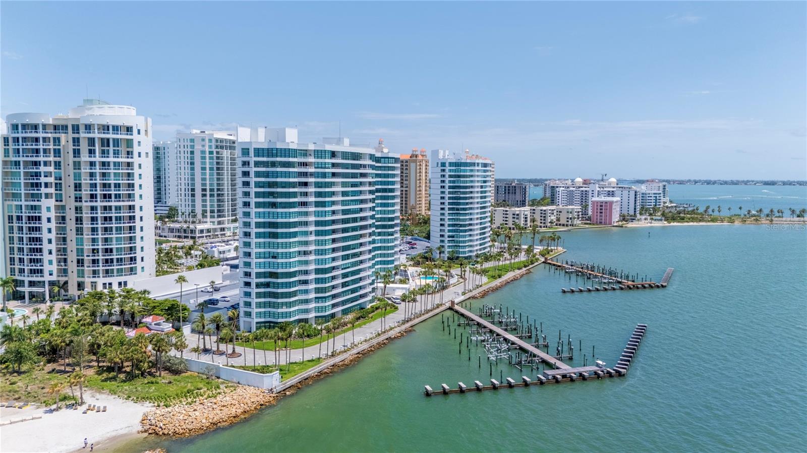 A move in Ready- Rare find 12th floor 3 bed 2 /1 bath condo with Breathtaking views!! Open and bright layout with large sliding doors that lead to your expansive balconies. Well designed Spacious rooms, Primary bedroom overlooking the Bay, large walking closets. The kitchen is in the center of the living room with beautiful views -Stainless Steel appliance, Granite countertops and so much more. 24/7 Staffed Security, concierge service, two-resort style pools overlooking the Bay, two fitness centers, tennis courts, pickleball courts, concierge services, boat/kayak docs with fishing pier and one assigned under-building parking space with secure access storage. Walking distance to the Van Wezel Arts Center, The renowned 53-acre Bay Park, downtown Shops and restaurants. Short drive to Lido Key airport and so much more. If you're looking for a place that offers tranquility and prestigious this is a dream! Call today to make this yours!