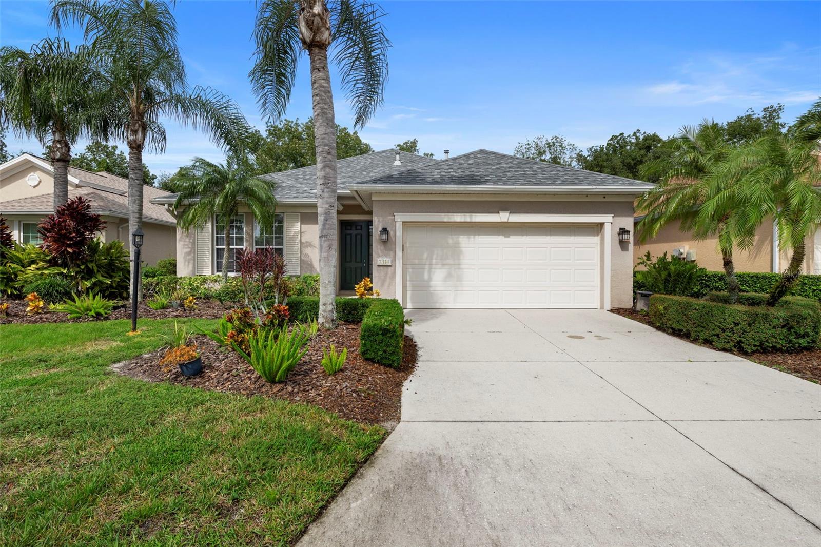 Step into this beautifully maintained 2-bedroom, 2-bath home where natural light and tranquil preserve views create an atmosphere of comfort and elegance. The kitchen will impress with its gas cooktop, sleek black quartz counters, and abundant storage, while the charming breakfast nook and extended lanai provide the perfect backdrop for enjoying peaceful mornings or entertaining guests. The spacious backyard, accented by mature Magnolia and Hong Kong Orchid trees, offers plenty of room to add a pool if desired.
The primary suite is a serene retreat with inviting spaces and picturesque views, while the private guest wing includes a flexible second bedroom or den, a built-in office nook, and a full bath—ideal for visitors or working from home.
Nestled within one of the most sought-after communities along the University Park corridor, residents enjoy gated entrances, winding streets lined with manicured landscaping, sparkling lakes with fountains, nature trails, and access to two community pools with fitness facilities, a summer kitchen, and playgrounds.
Convenience is unmatched—walk or bike to nearby dining, Fresh Market, Starbucks, and more. This home combines comfort, style, and location for a lifestyle you’ll love.