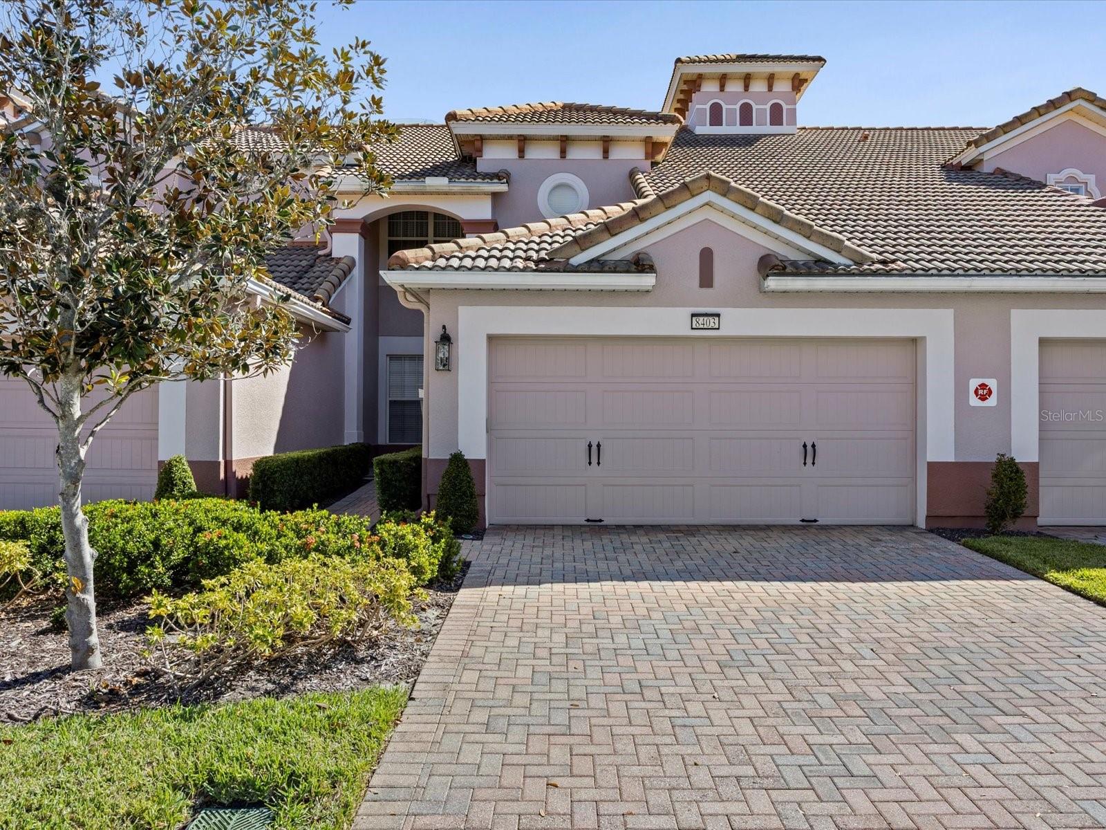 Beautifully maintained, fully furnished townhome with tranquil pond views in the gated, resort-style community of Bella Trae in Davenport, FL. Used only as a second home and move-in ready, this residence is a short walk to the clubhouse and pool. The open first floor features upgraded flooring, crown molding, and ceiling fans. A stylish kitchen boasts stainless steel appliances, granite countertops, upgraded backsplash, and pantry, plus a dining area and cozy breakfast nook. Enjoy morning coffee on the large enclosed lanai overlooking the water. Upstairs, the primary suite offers a tray ceiling, oversized walk-in closet, and spa-like bath with dual sinks, walk-in shower, and soaking tub. Two guest bedrooms share a full bath. An attached two-car garage includes built-in shelving. HOA covers lawn care, basic cable, internet, and access to amenities: zero-entry pool, hot tub, clubhouse, fitness center, tennis, putting green, billiards, and community grills. Close to golf, dining, shopping, I-4, and Orlando’s world-famous theme parks.